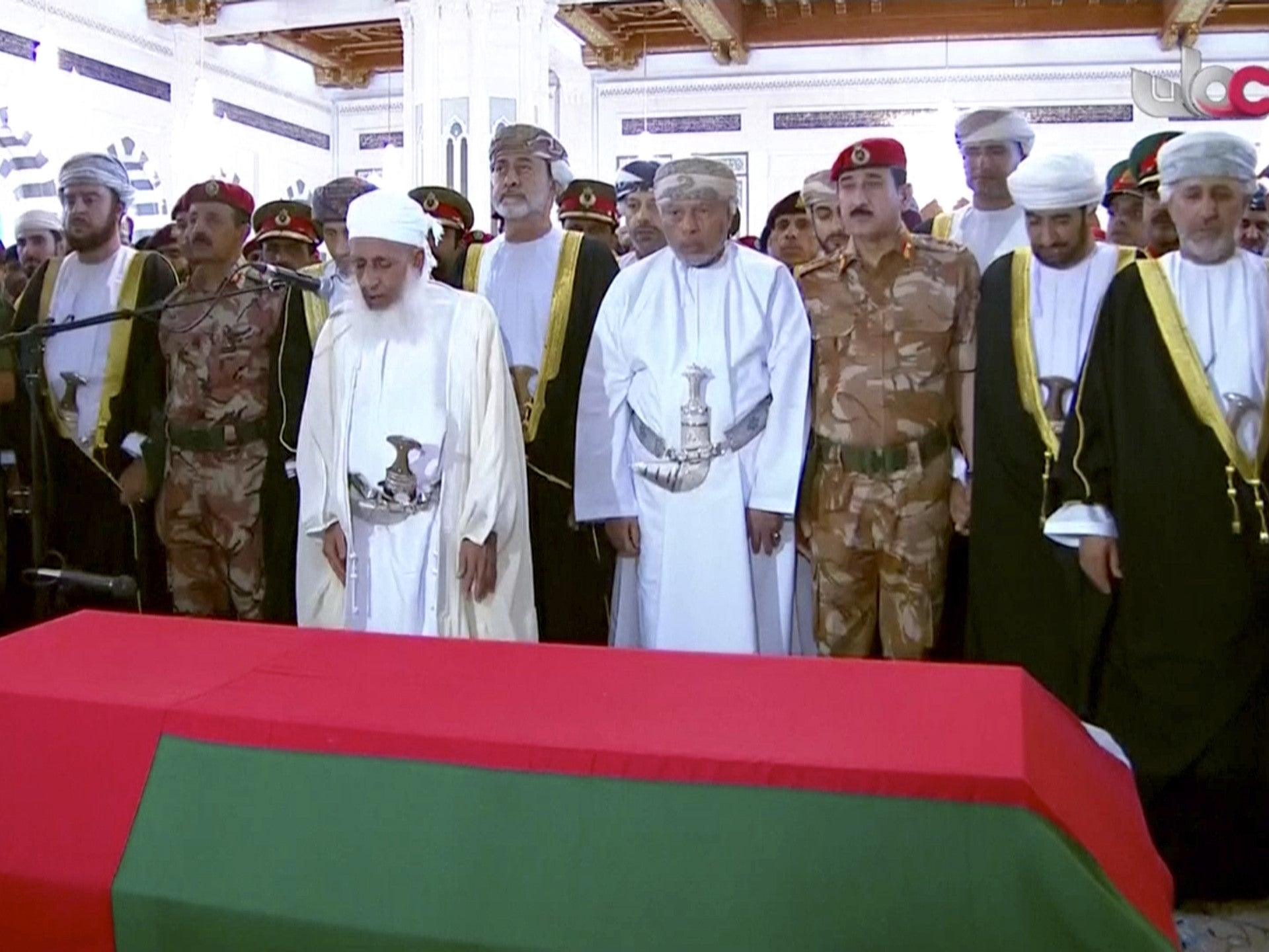 Oman’s new sultan Haitham bin Tariq Al Said (centre, in black and white robes), attends the prayer ceremony over Qaboos coffin at Qaboos Grand Mosque in Muscat