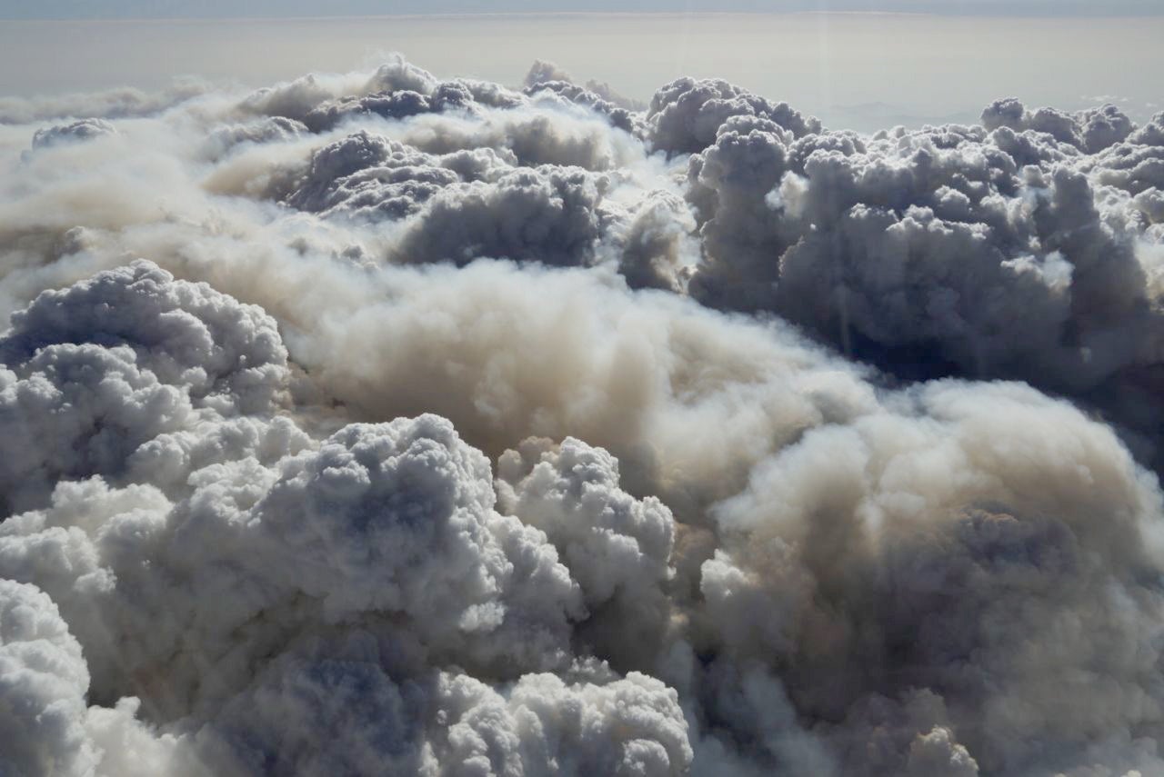 A storm cloud forming over fire-affected areas near the NSW and Victoria border