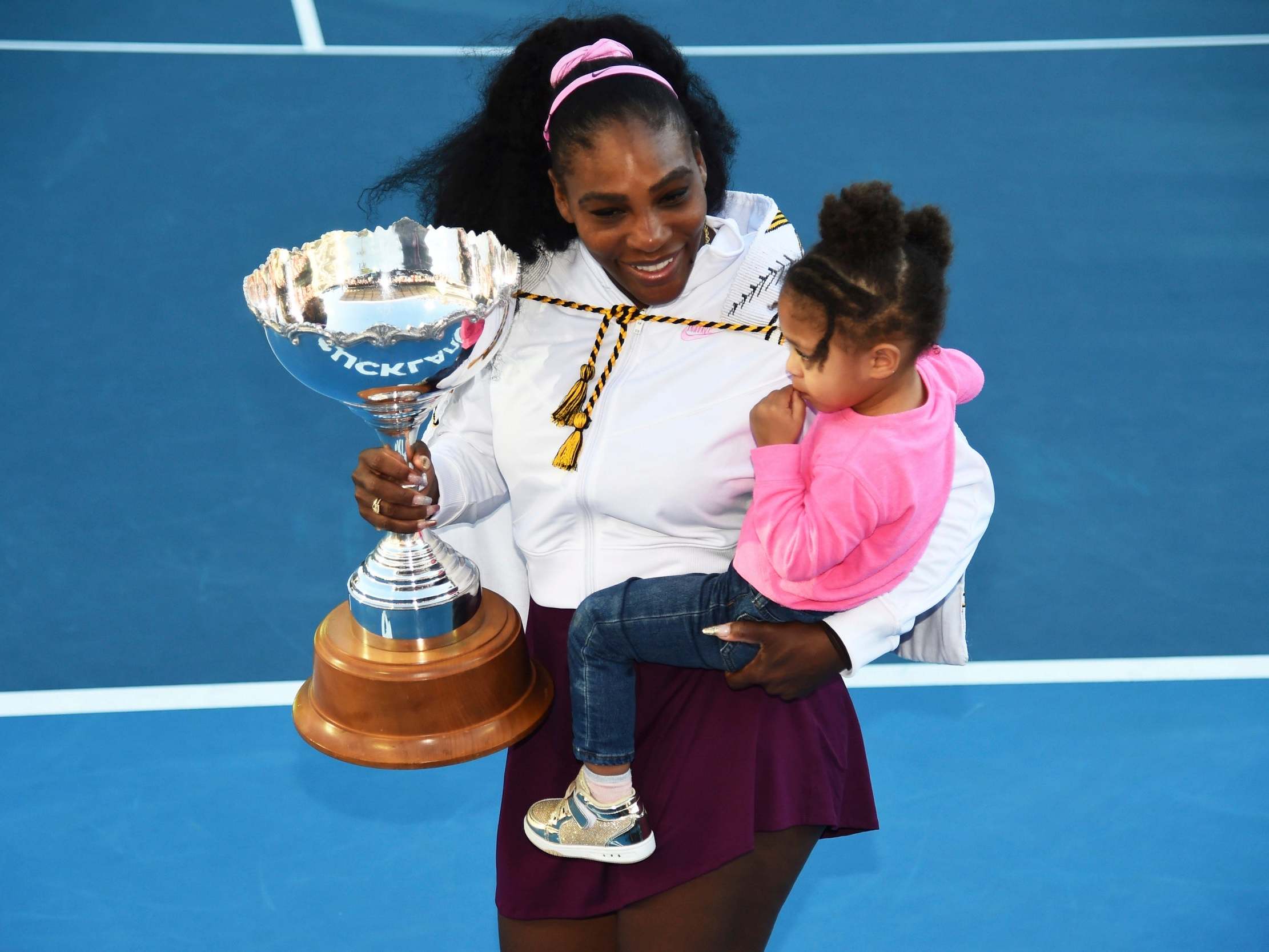 Serena Williams celebrates on court with her daughter, Alexis Olympia Ohanian Jr