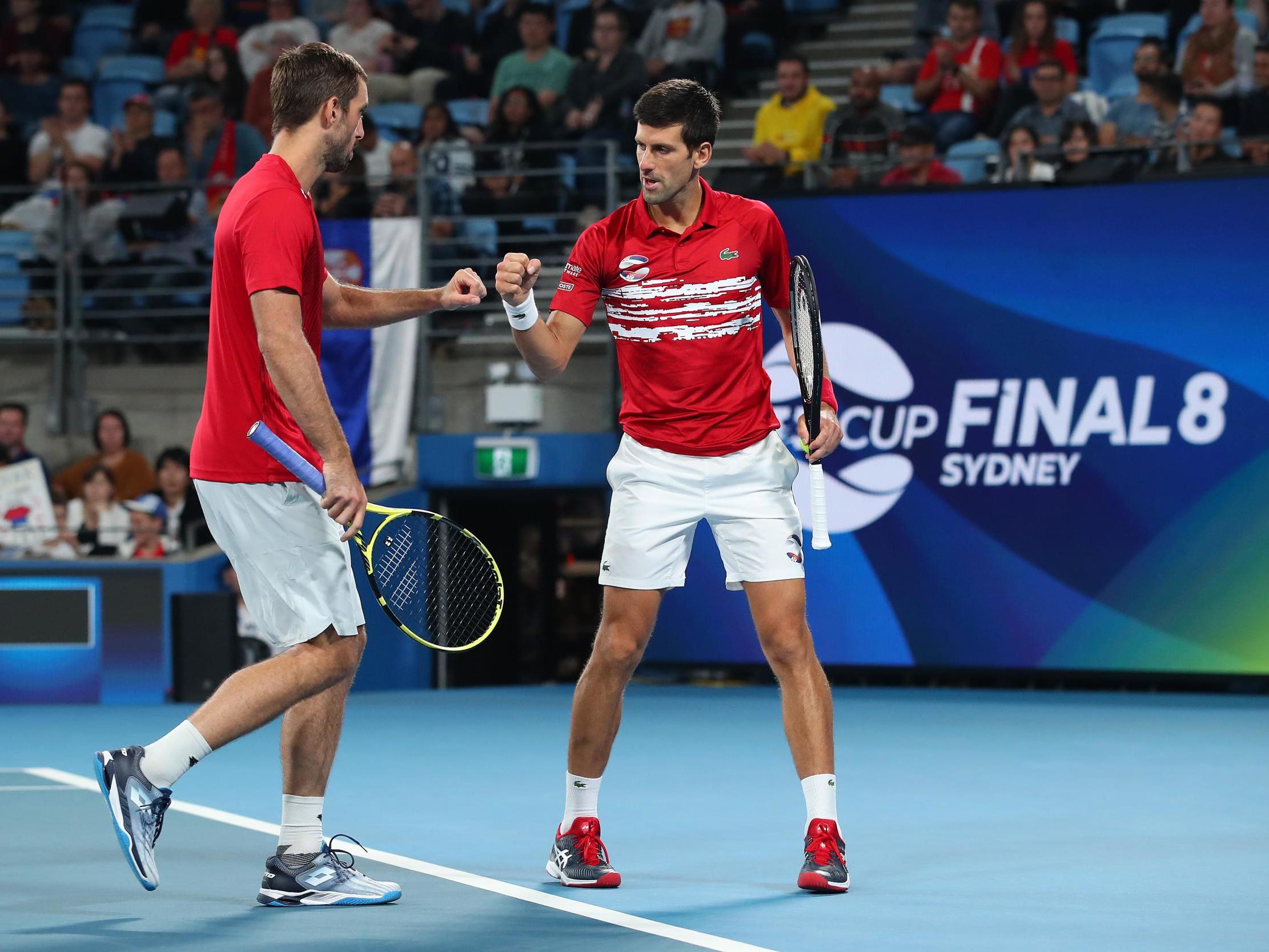 Novak Djokovic and Viktor Troicki celebrate winning a point in the doubles