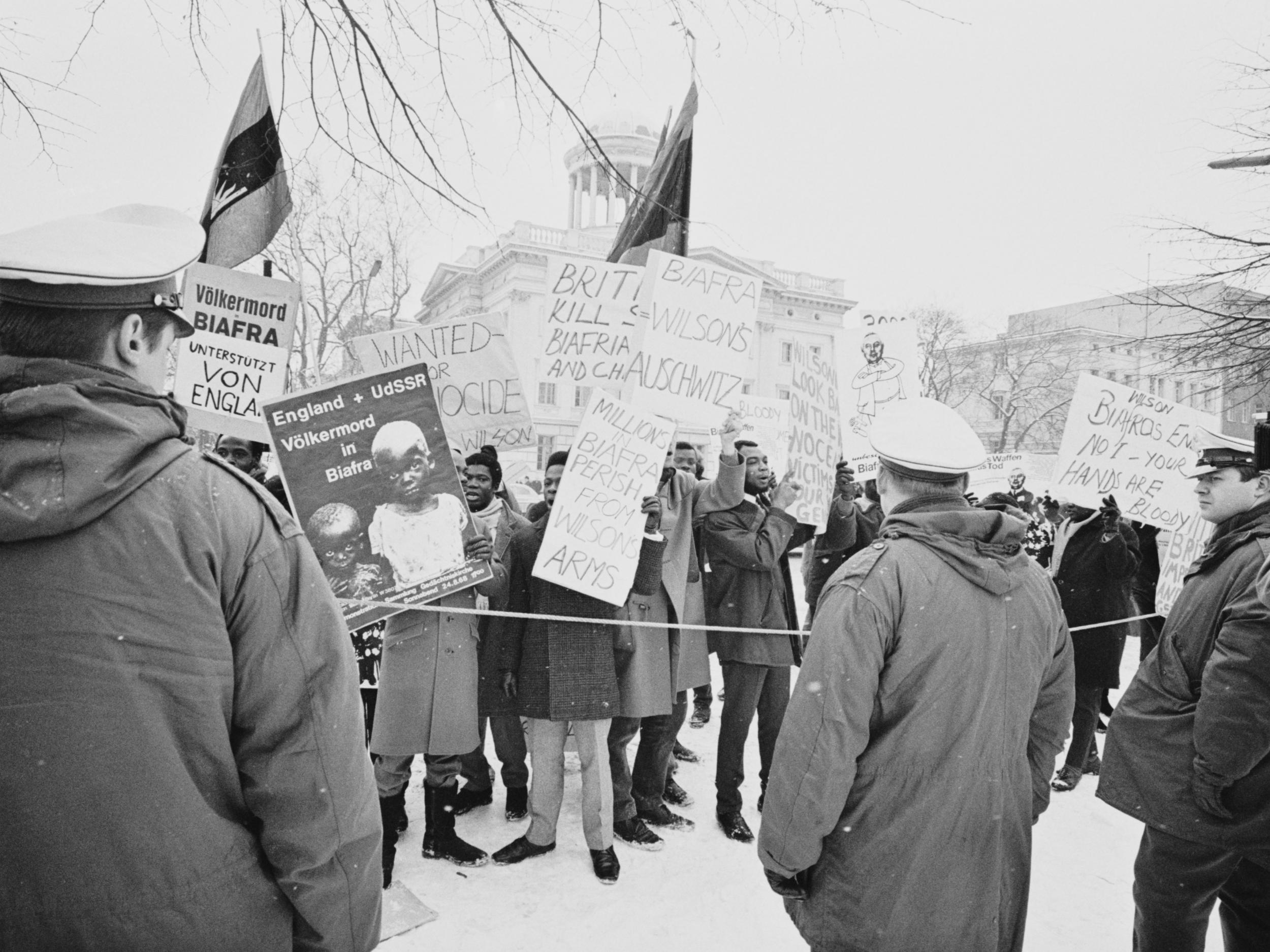 Demonstrators protest against the United Kingdom’s involvement in the Biafran war as Harold Wilson visits Germany in 1969