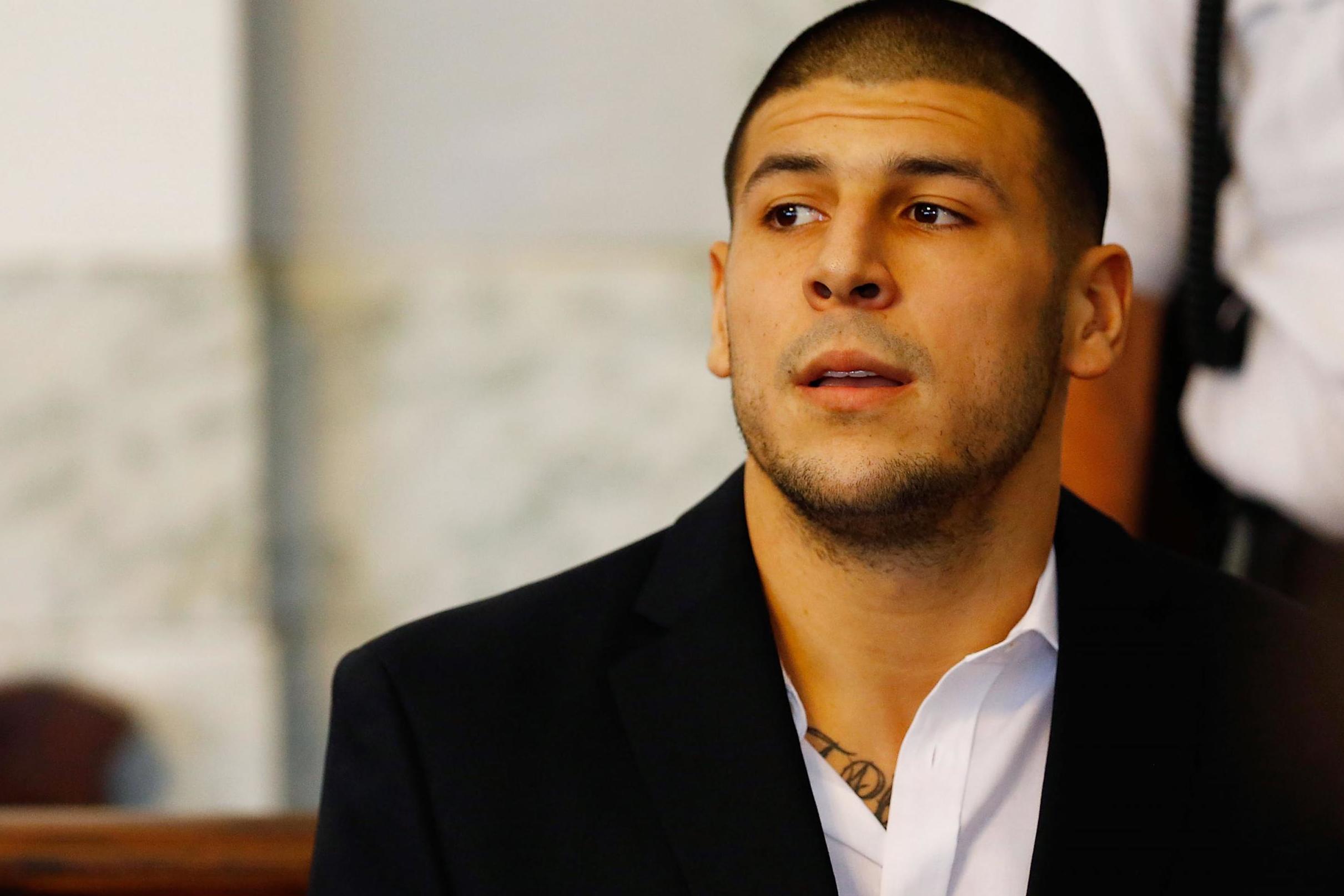 Aaron Hernandez sits in a Massachusetts courtroom in August 2013. Hernandez was diagnosed with CTE after his death four years later. Former NFL players who believe they have CTE are also more likely to be suicidal, according to new research.