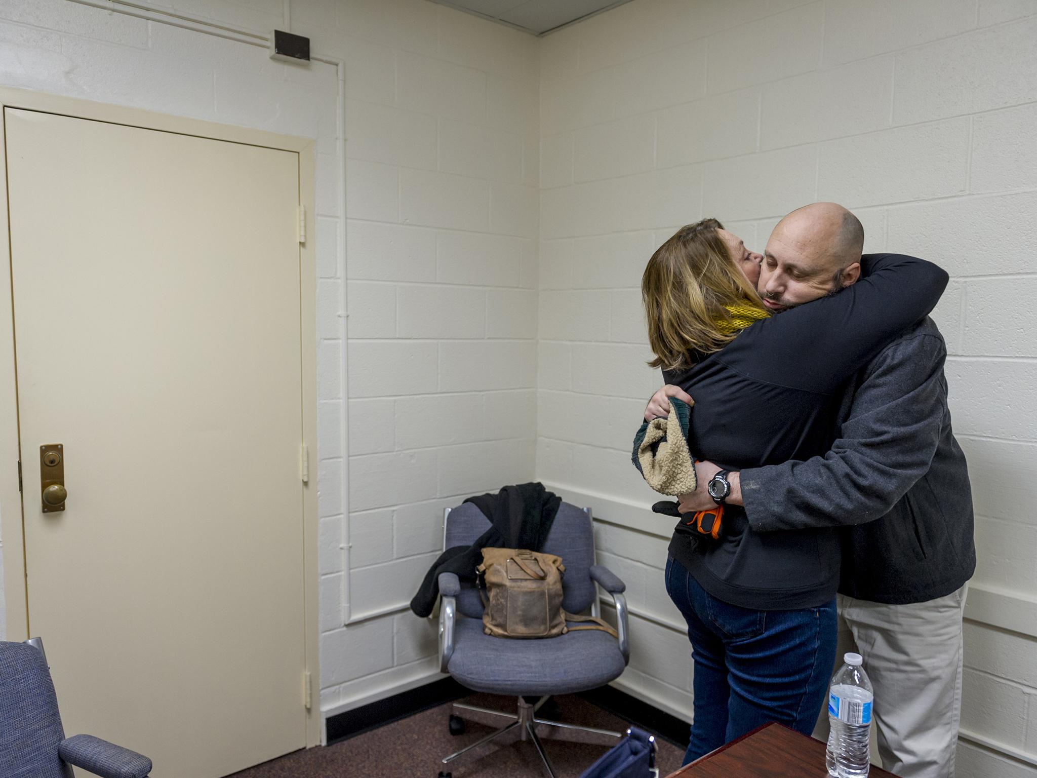 Anita hugs her son at the end of a visit (The Washington Post)