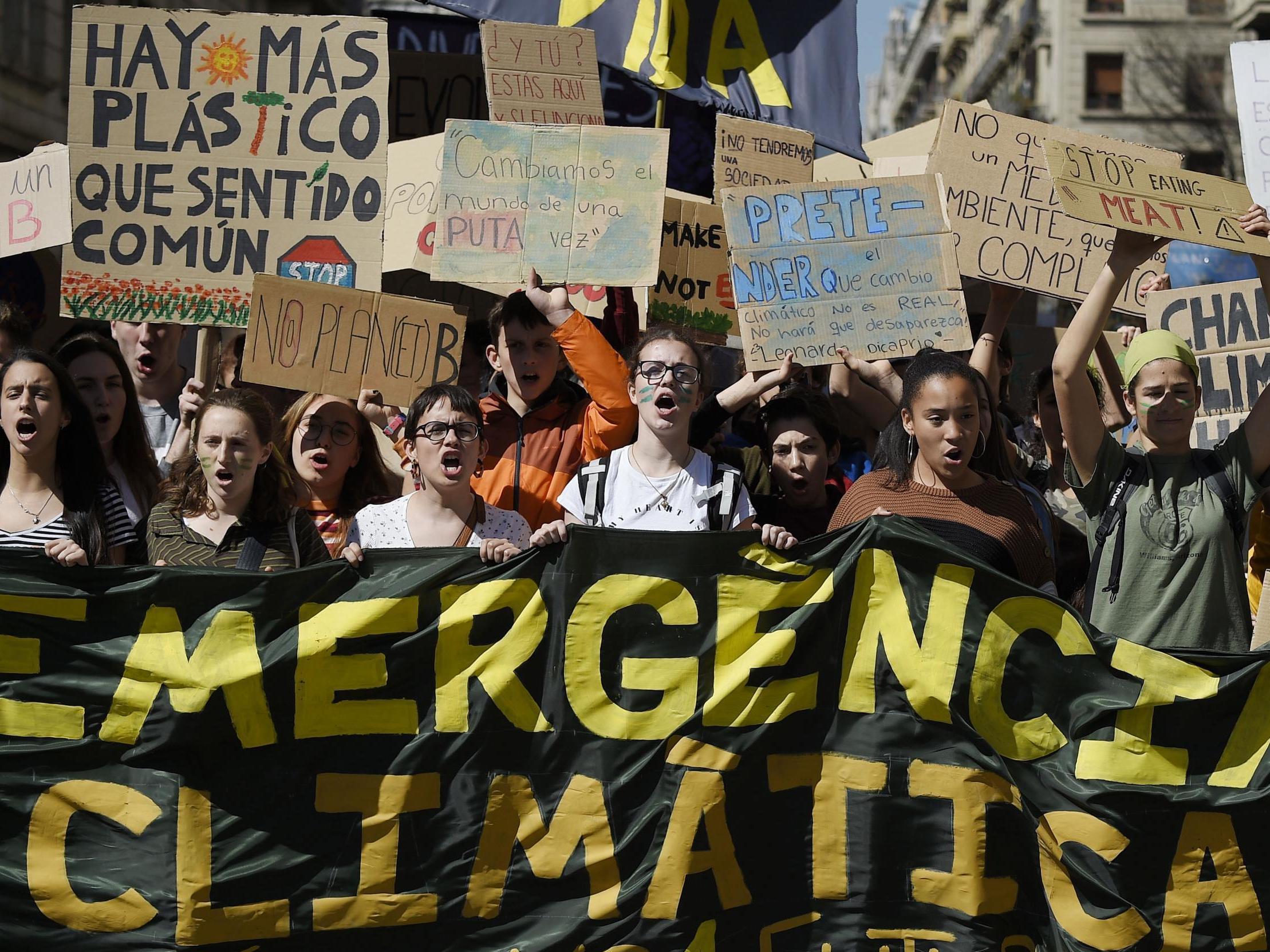 Students demonstrate behind a banner reading "Climate emergency" on March 15 2019 (Llluis Gene/AFP Getty)