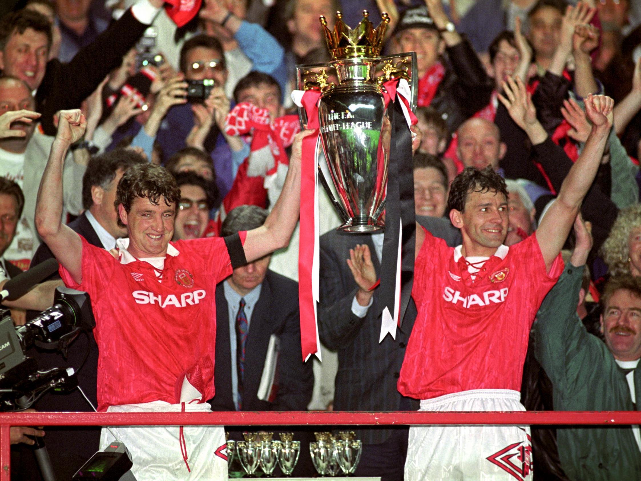 Steve Bruce and Bryan Robson celebrate winning the Premier League title in 1993