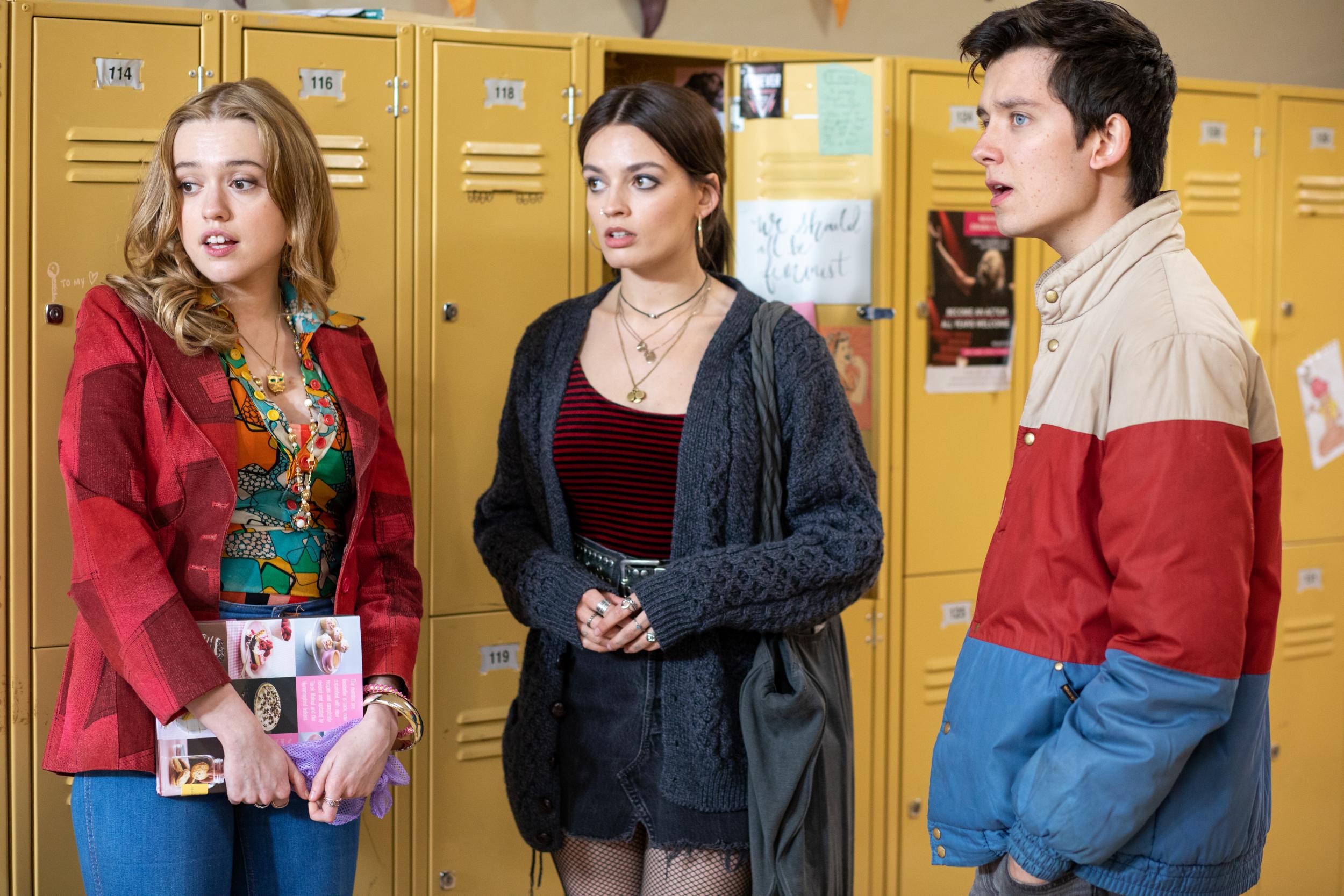 Aimee (Aimee Lou Wood), Maeve (Emma Mackey) and Otis (Asa Butterfield) in the corridors of Moordale High