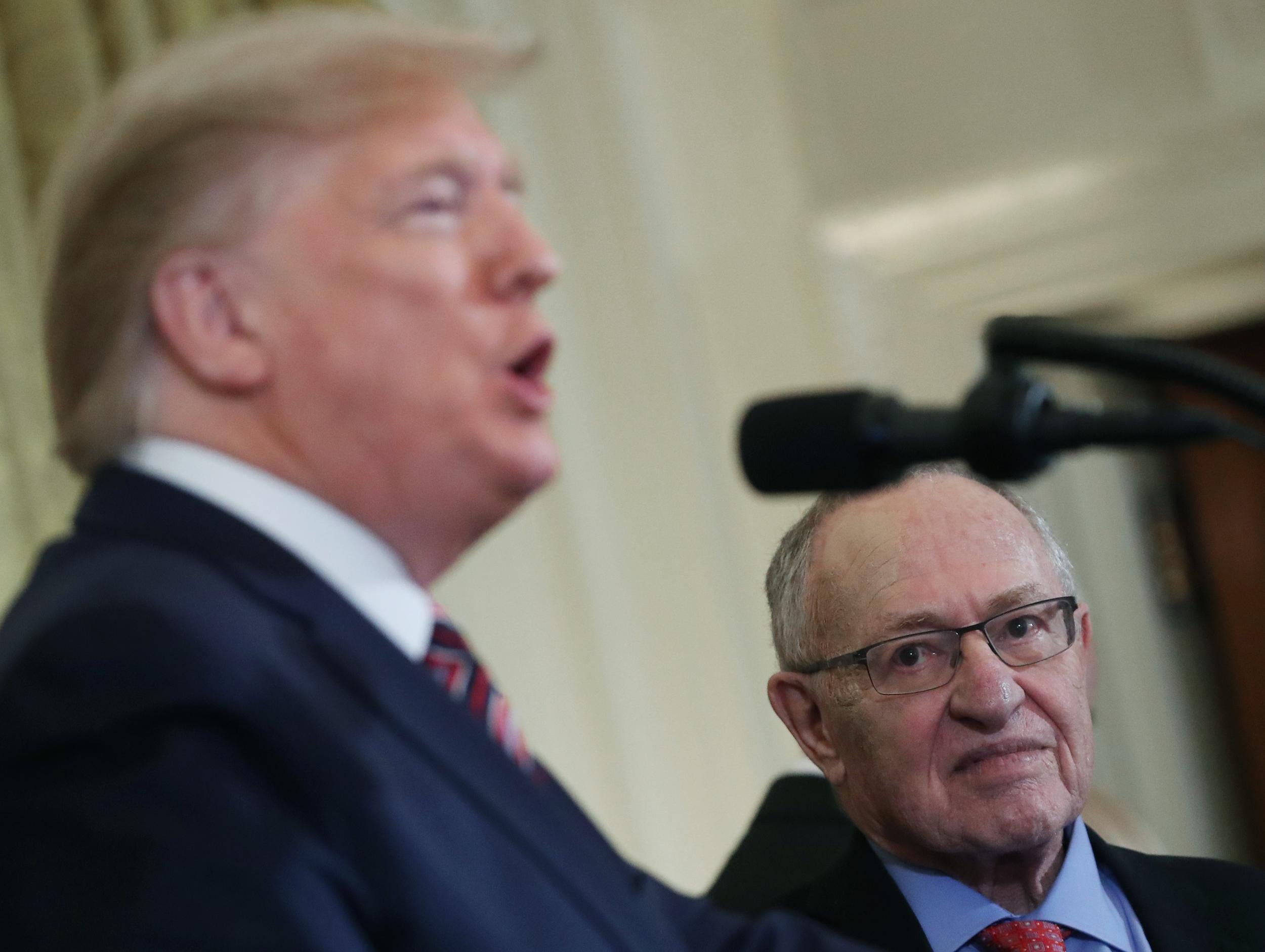 Professor Alan Dershowitz listens to Donald Trump