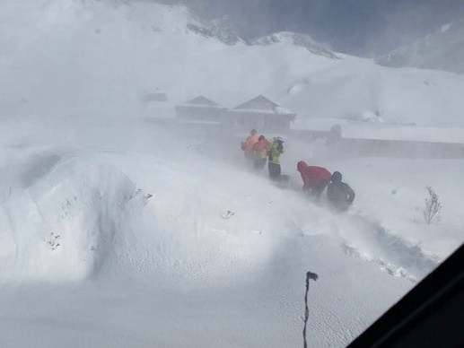 Climbers await rescue after an avalanche hit in Deurali