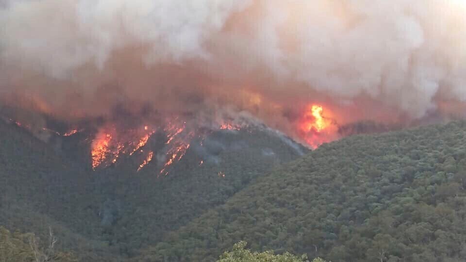 Smoke rises from wildfires burning in East Gippsland, Victoria