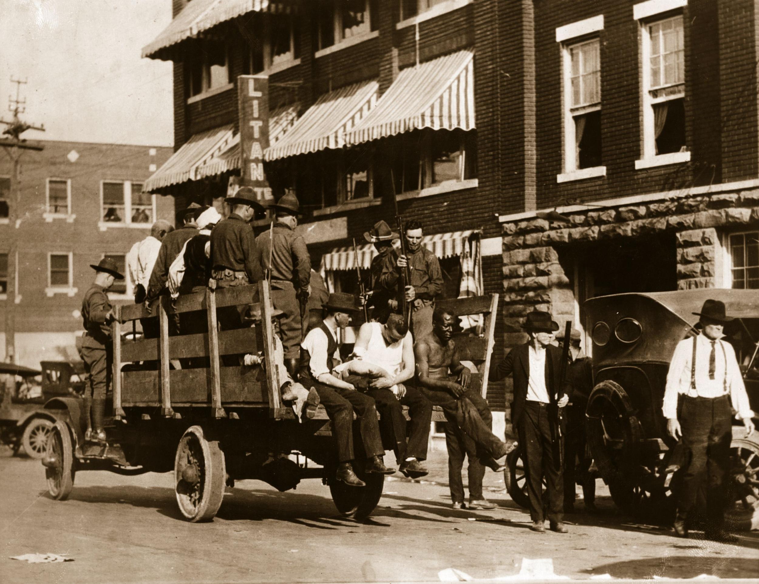 Injured and wounded prisoners are taken to hospital under guard after the Tulsa, Oklahoma race riots in 1921 when up to 300 African-Americans were massacred by white mobs