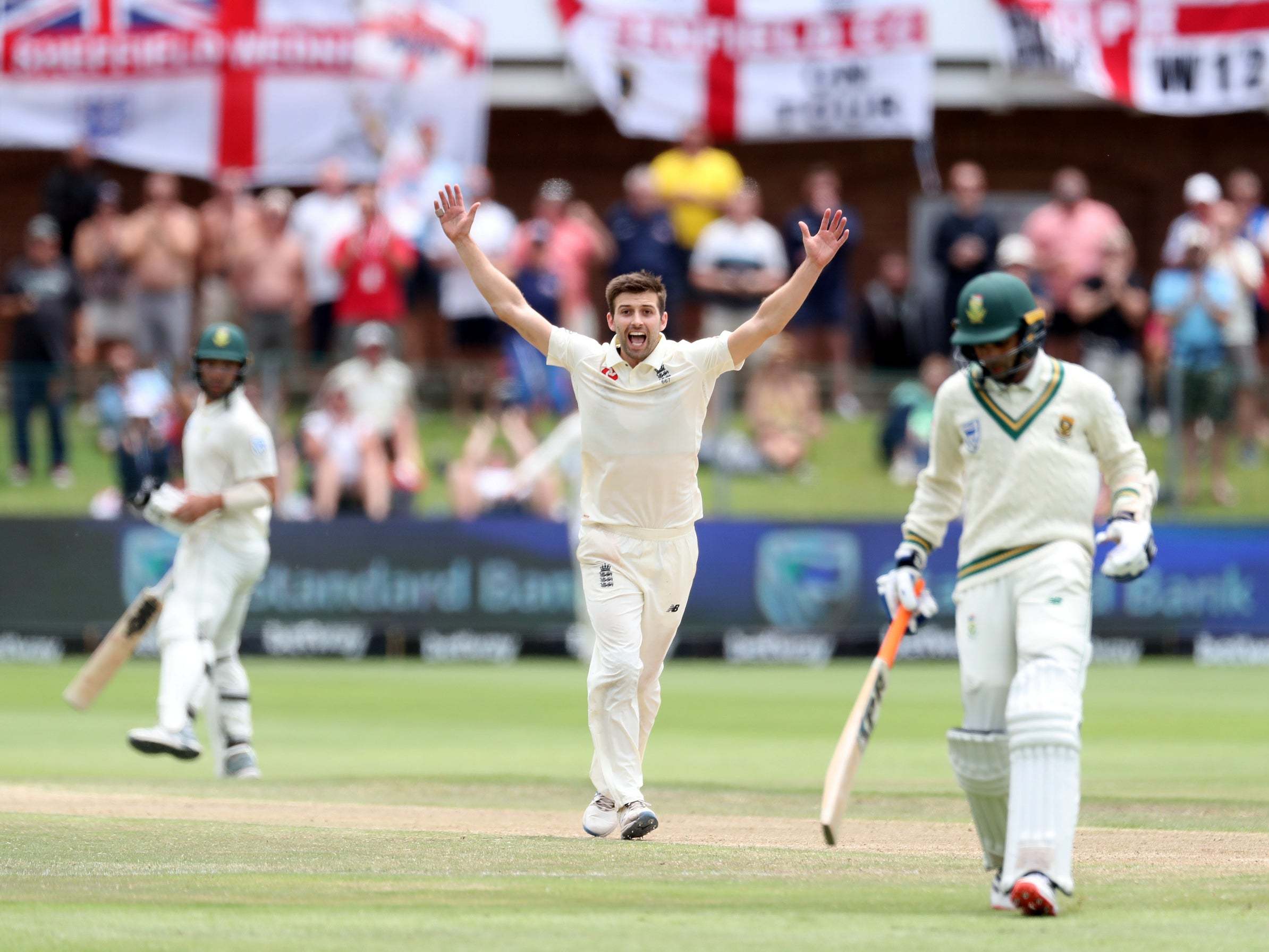 Mark Wood celebrates the wicket of Keshav Maharaj