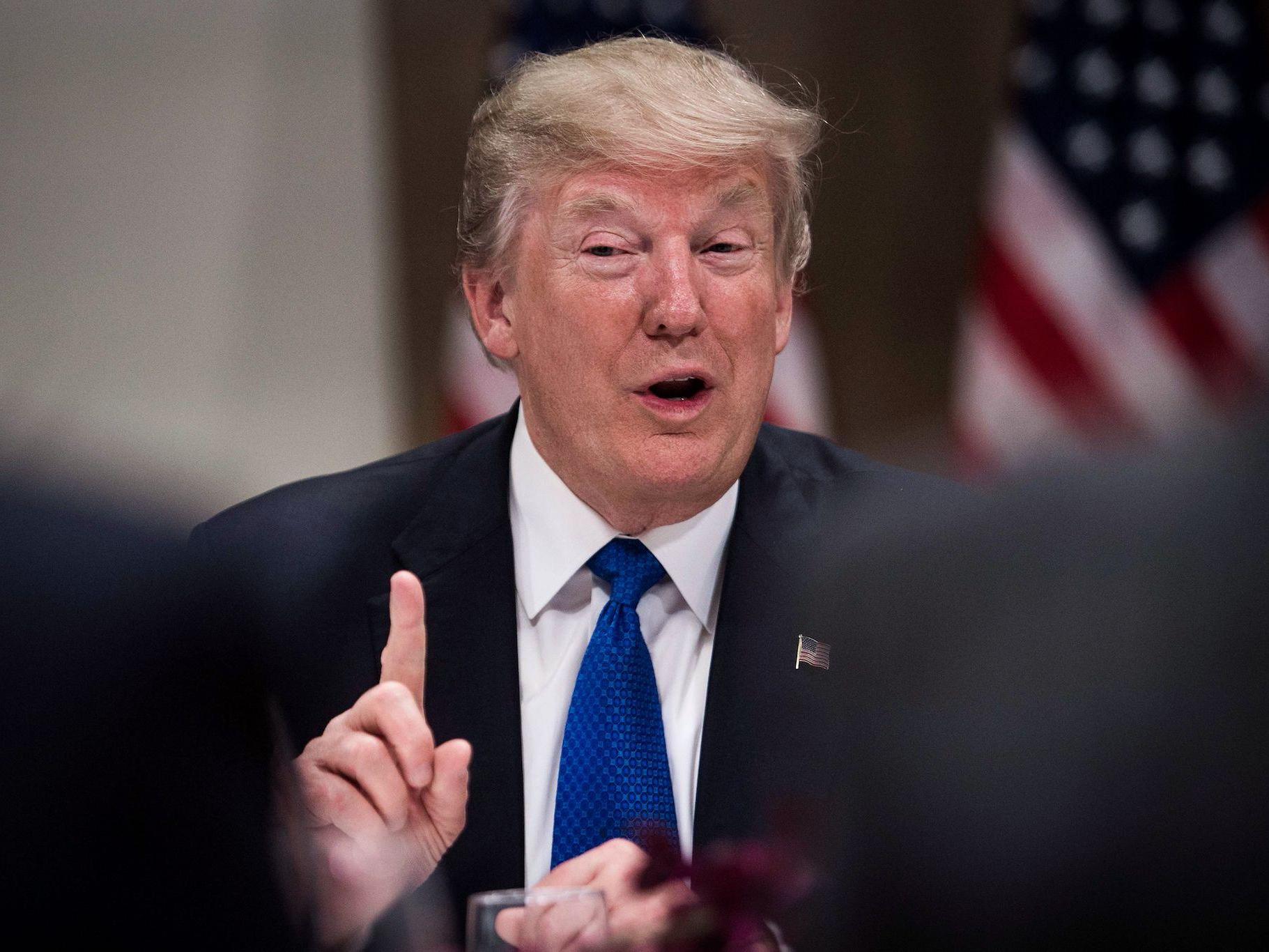 US President Donald Trump gestures as he speaks during a working dinner with European business leaders during the World Economic Forum (WEF) annual meeting in Davos