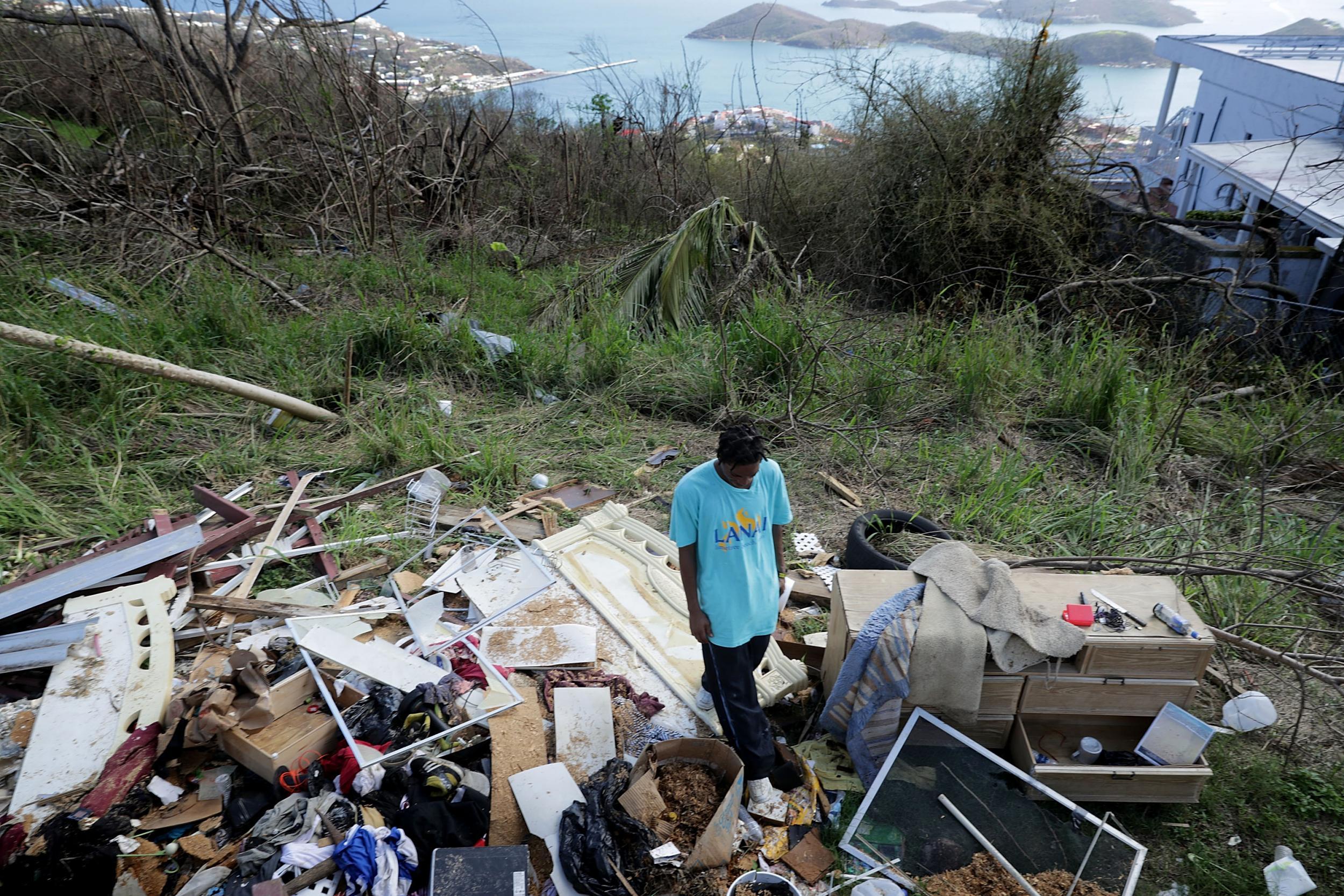 On the island of St Thomas, Tristan Joseph stands among his possessions in the aftermath of Hurricane Irma (Getty)