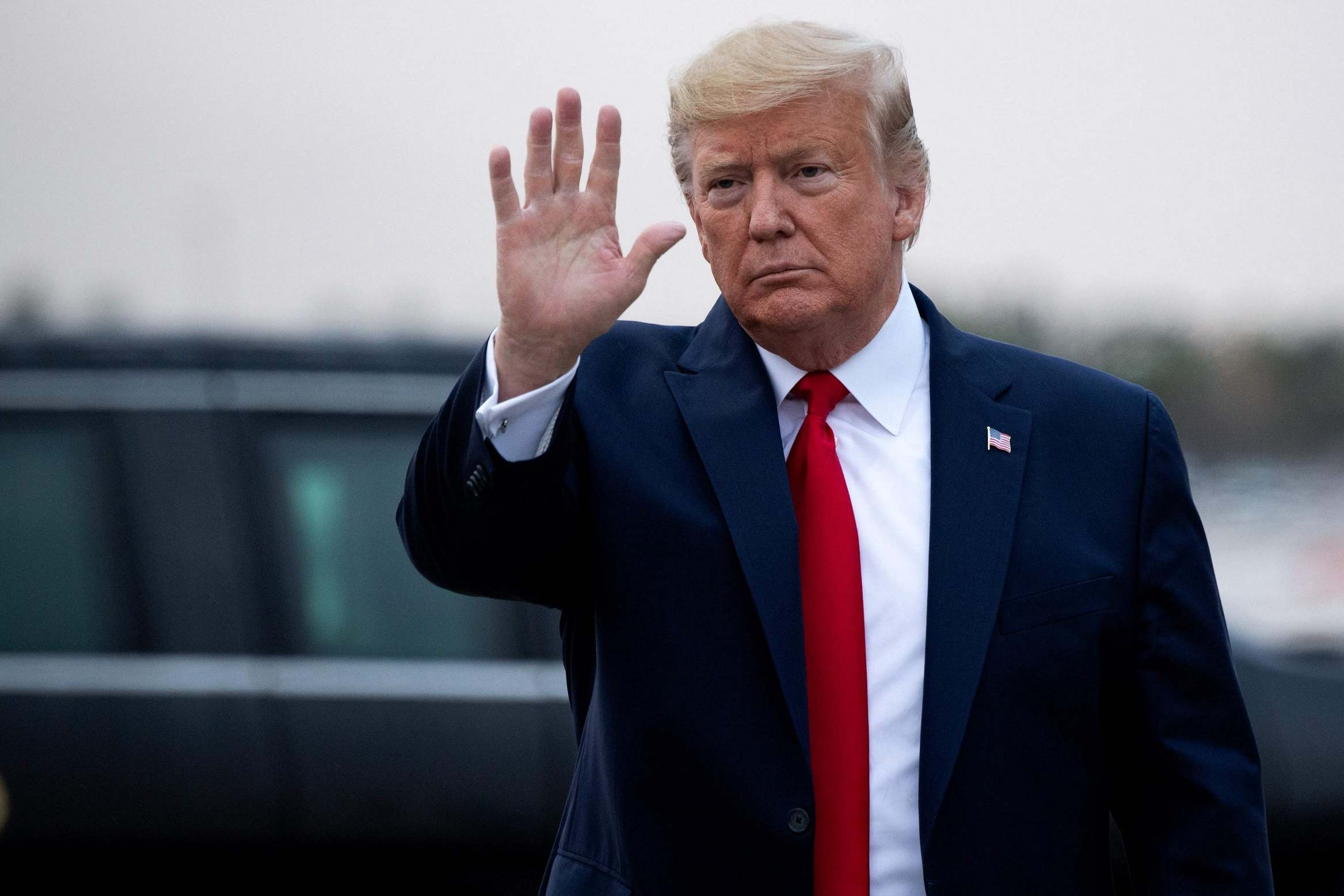 Trump disembarks from Air Force One upon arrival in Miami ahead of a speech at the Republican National Committee Winter Meeting