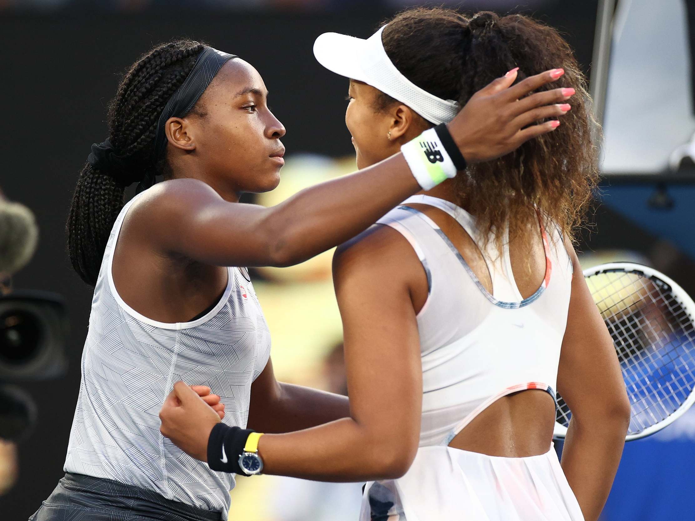 Gauff and Osaka embrace at the net after their third round match