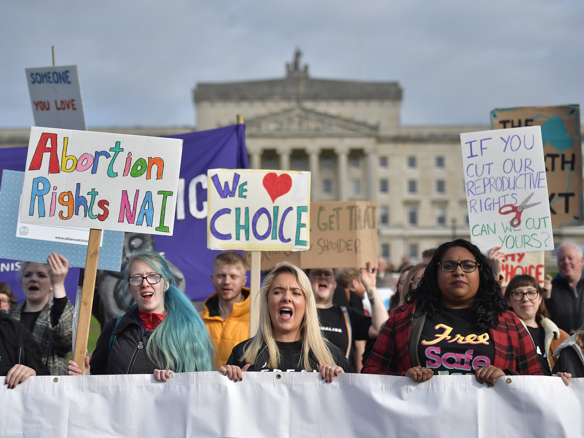 Abortion-rights demonstrators march through the streets of Belfast