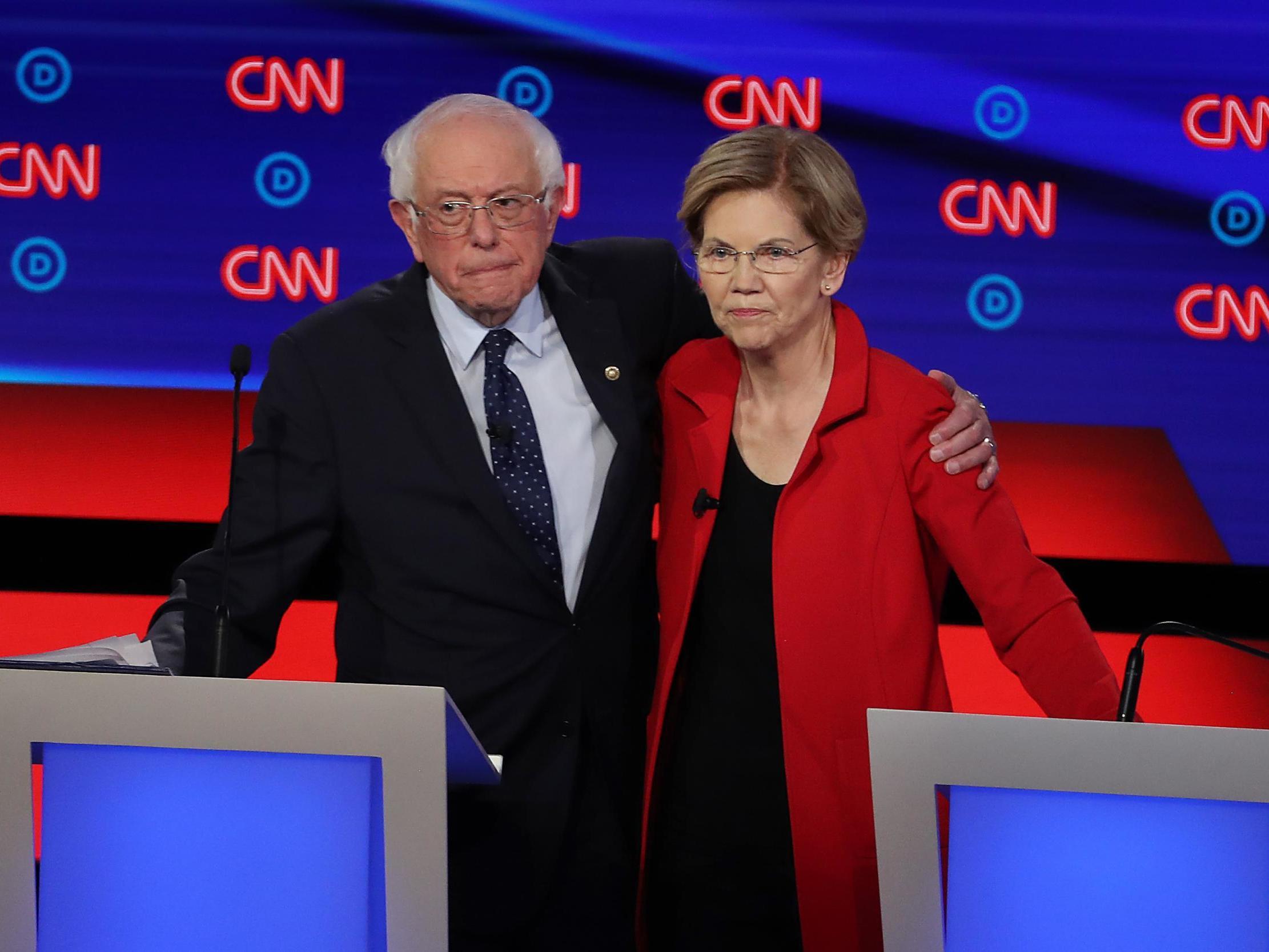 Democratic presidential candidate Sen. Bernie Sanders and Sen. Elizabeth Warren embrace after the Democratic Presidential Debate at the Fox Theatre on July 30 2019 in Detroit Michigan (Justin Sullivan/Getty Images)