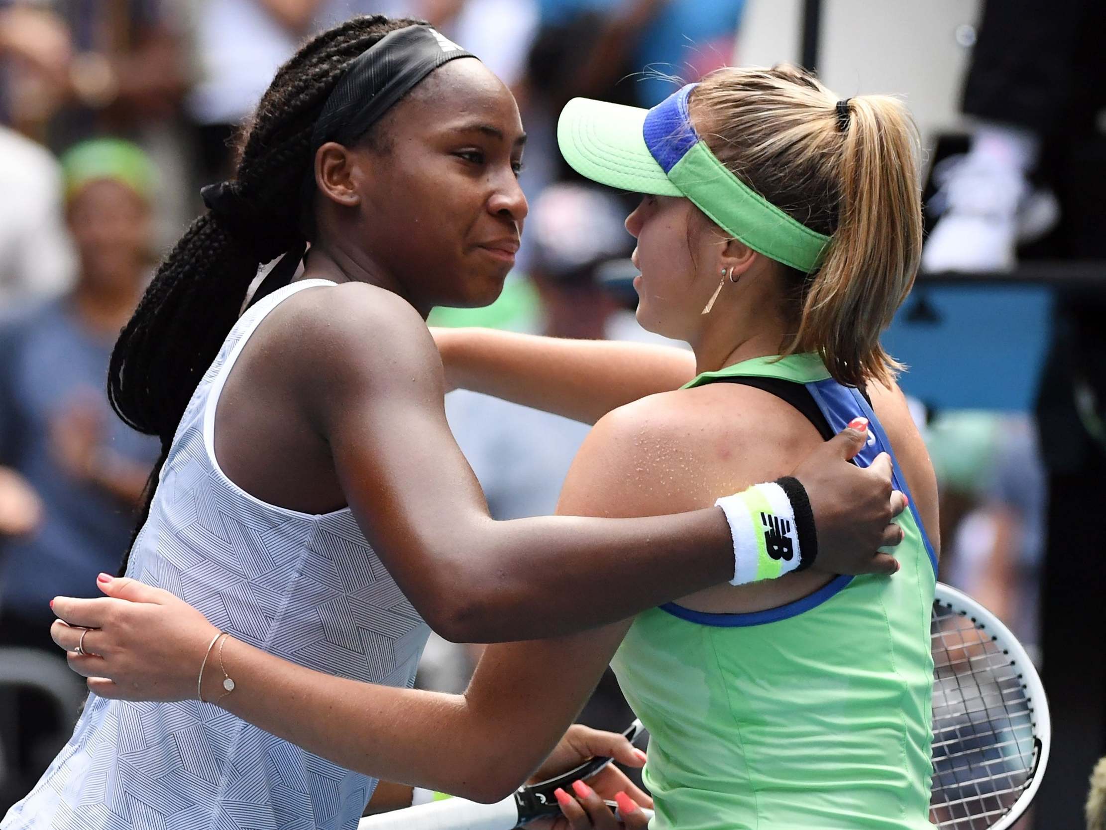 Coco Gauff and Sofia Kenin embrace after the match