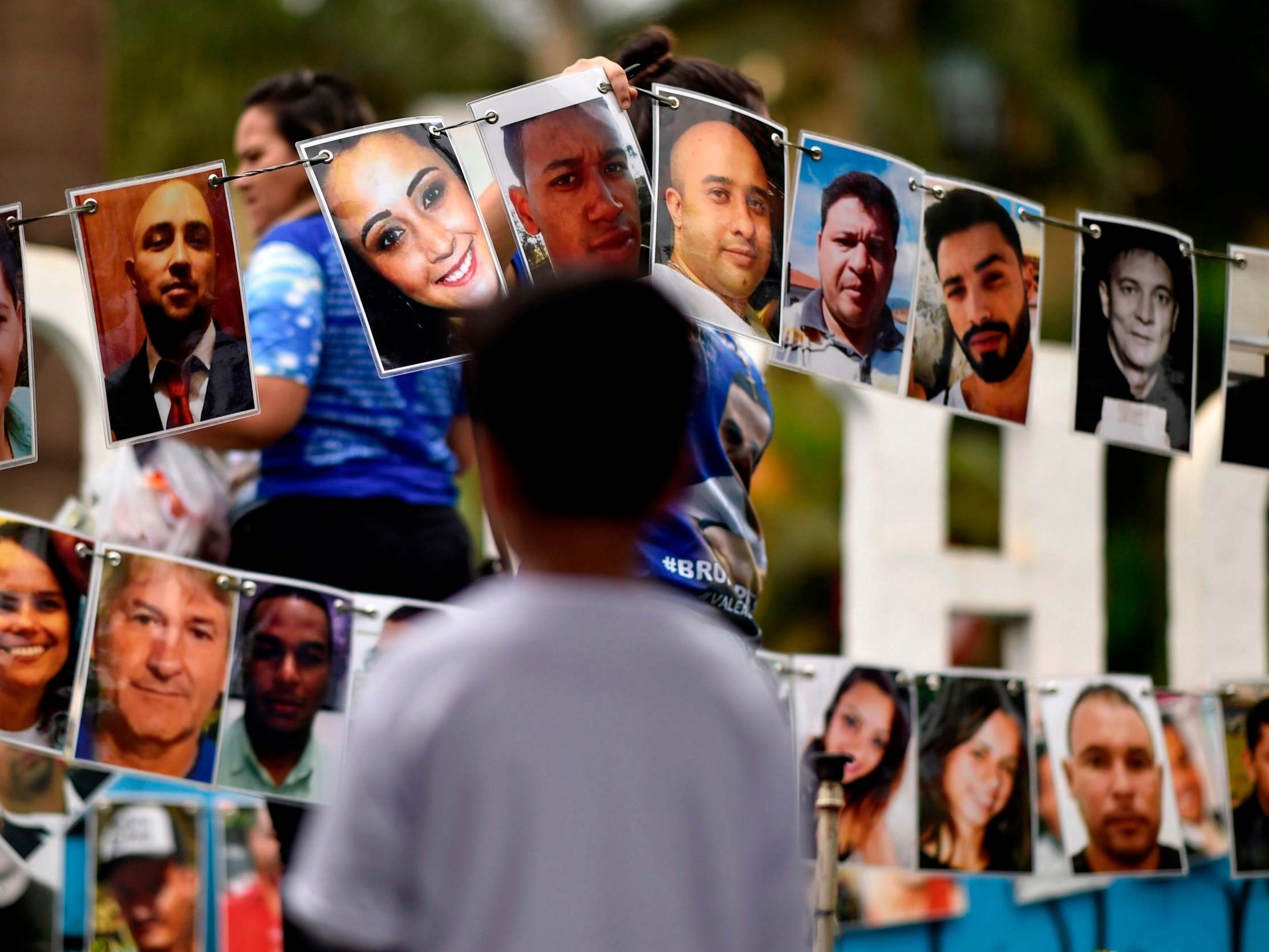 Portraits of the victims of the 25 January 2019 dam collapse on display during a tribute in Brumadinho