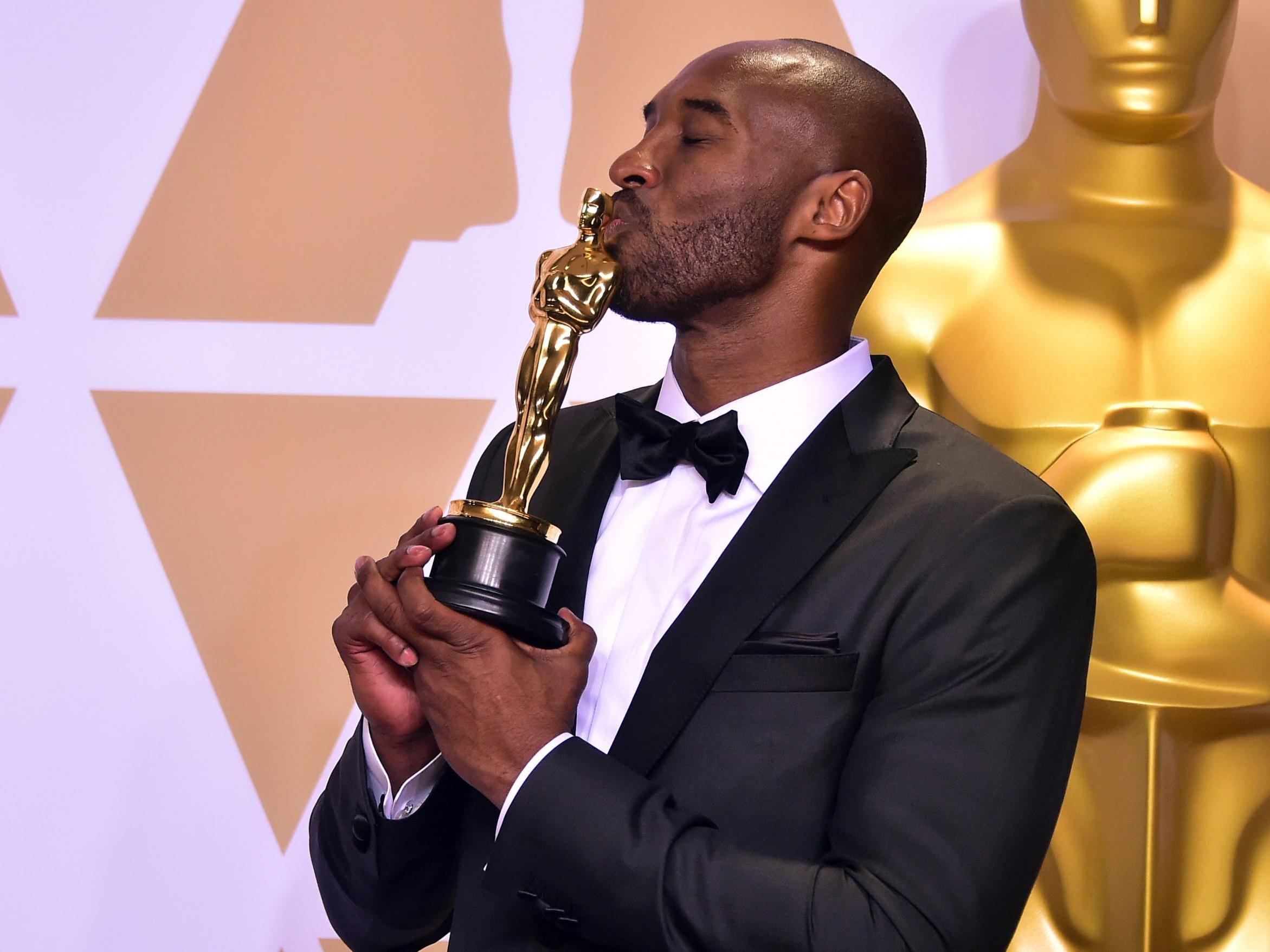 Kobe Bryant celebrating winning the Oscar