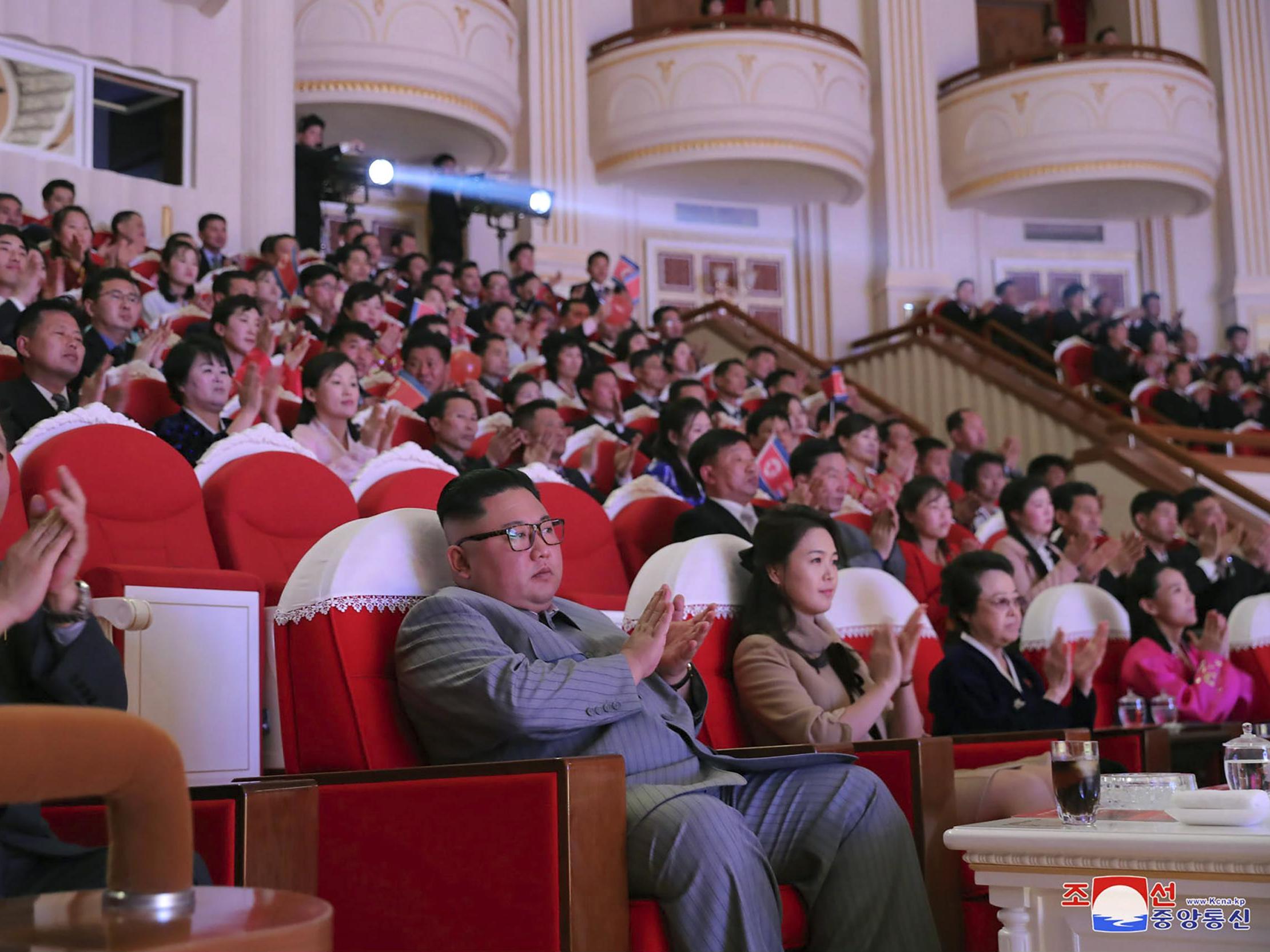 North Korean leader Kim Jong-un (centre) is shown sitting close to his aunt Kim Kyong-hui (second from right) on official state media pictures