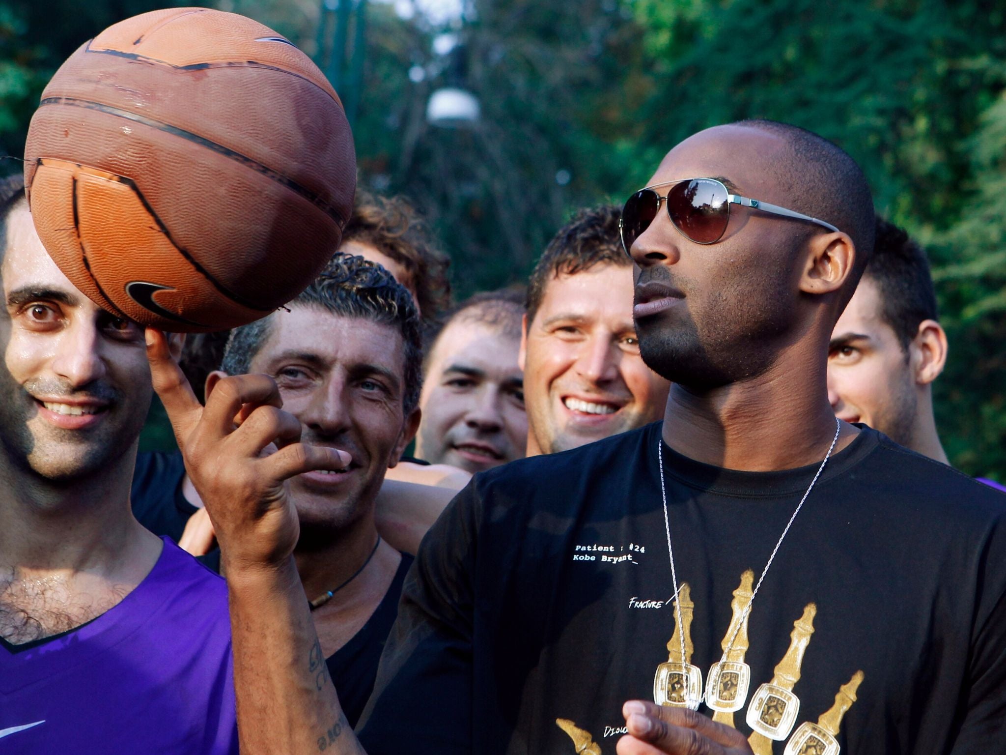 Bryant plays with a ball during a sponsor’s event in Milan during 2011