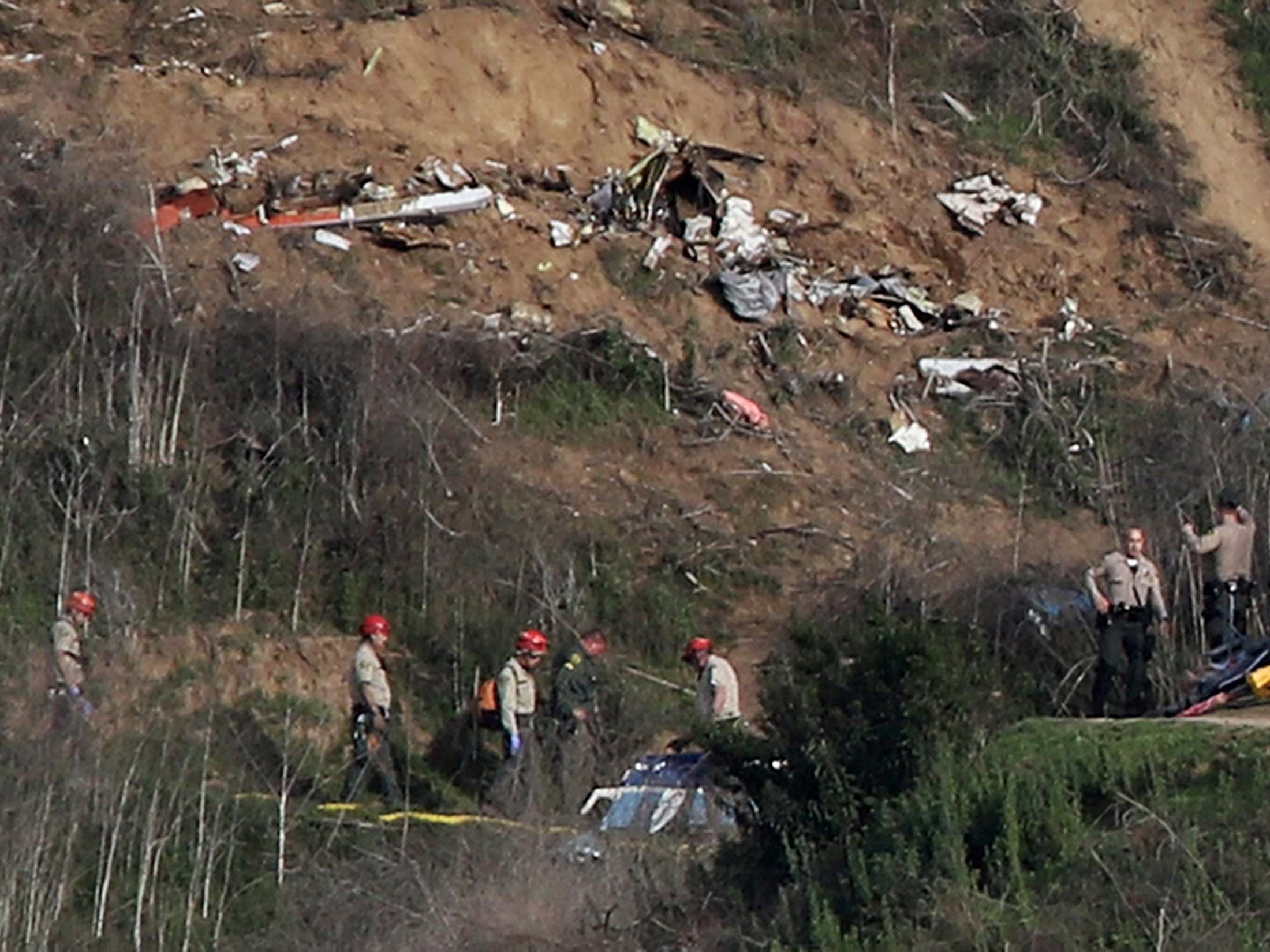 The crash site spans an area larger than a football field