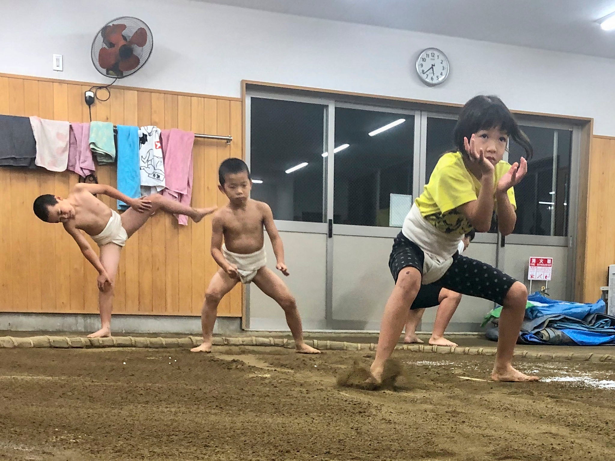 Himeka Suzuki, 7, performs a suri-ashi exercise during a practice, keeping her feet low as she glides across the ring