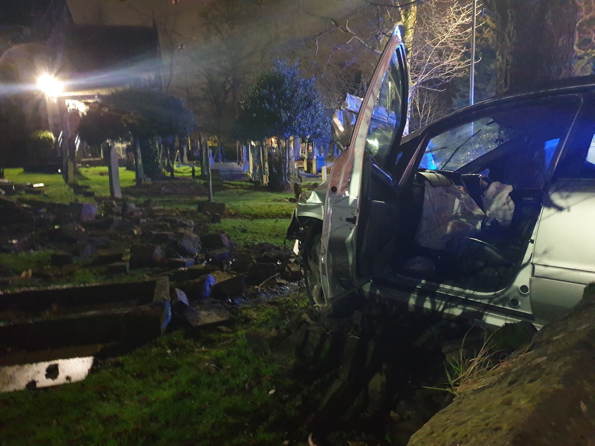 Police say driver in graveyard crash 'lucky' to have survived