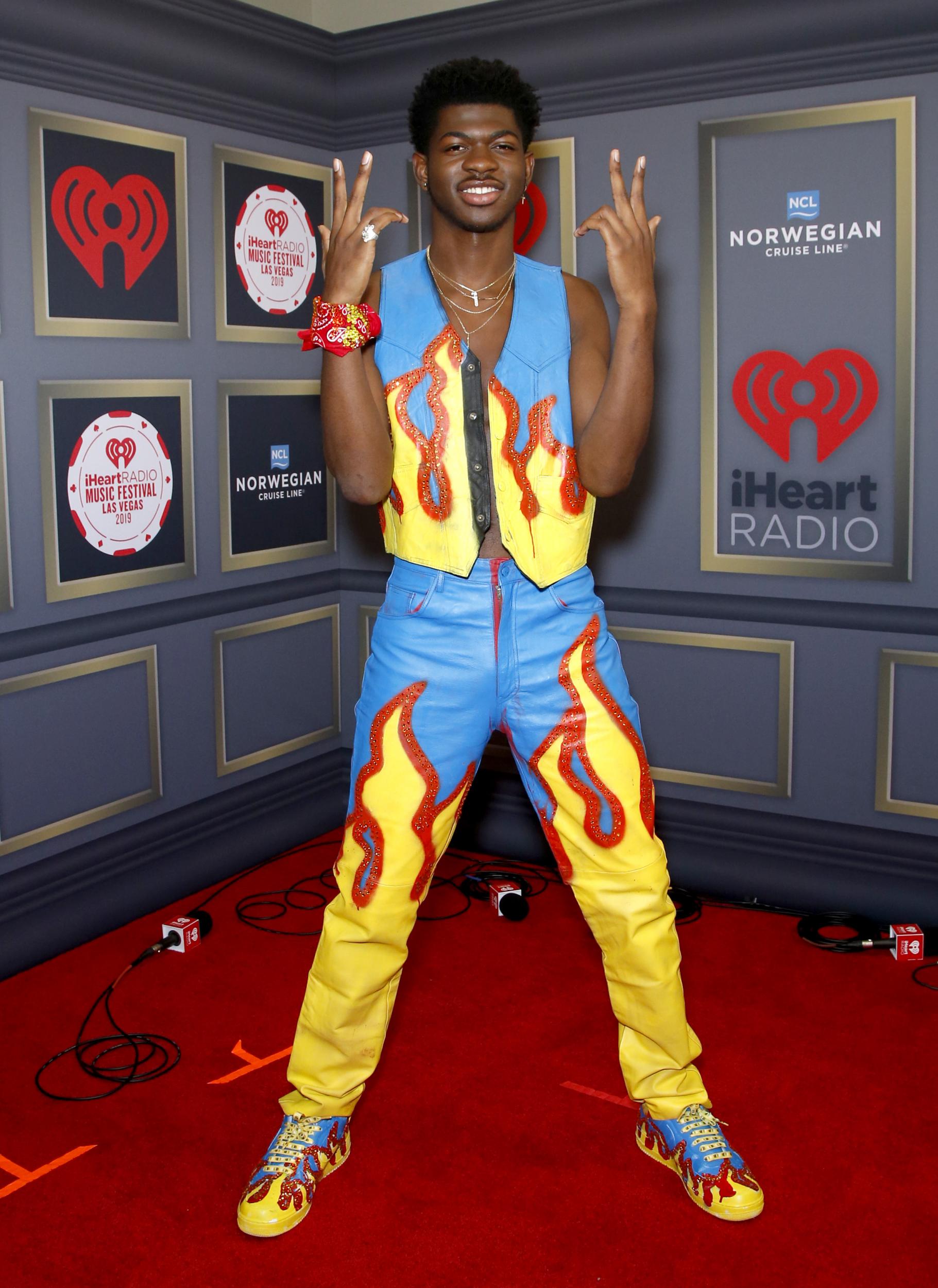 Lil Nas X was on fire at last year's iHeartRadio Music Festival, wearing a hand-painted outfit featuring flame imagery by fashion label Freak City LA.