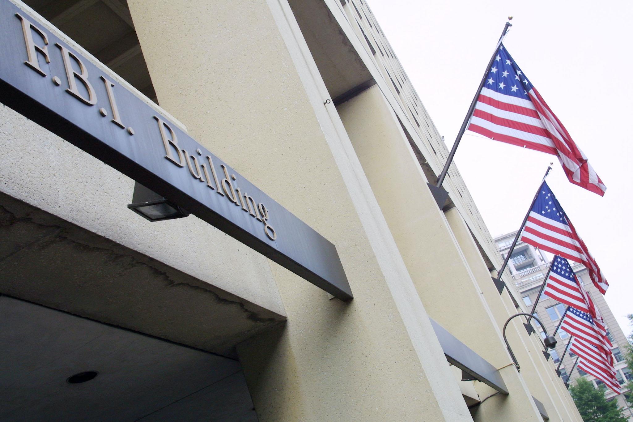 American flags fly over the Federal Bureau of Investigation (FBI) building July 18, 2001 in Washington, D. C.