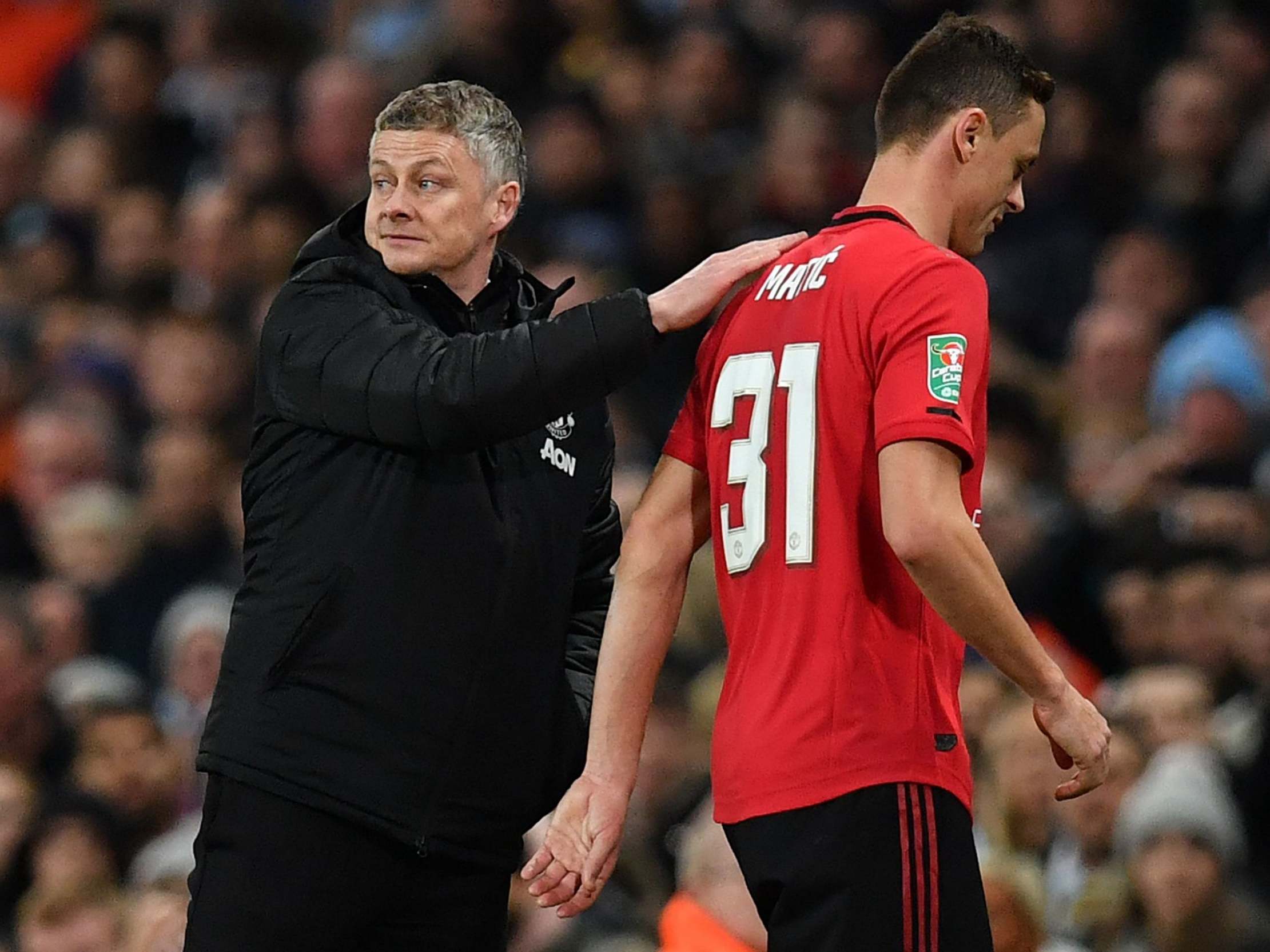 Manchester United manager Ole Gunnar Solskjaer taps Manchester United's Nemanja Matic