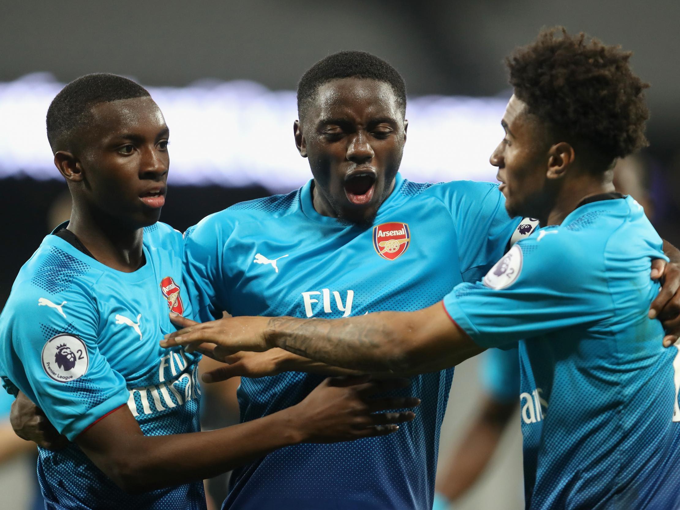 Josh Dasilva celebrates with Eddie Nketiah and Reiss Nelson in April 2018