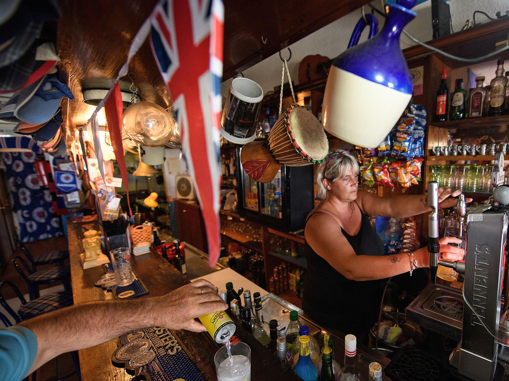 Union flag bunting hangs in the Bar None pub in Benalmadena