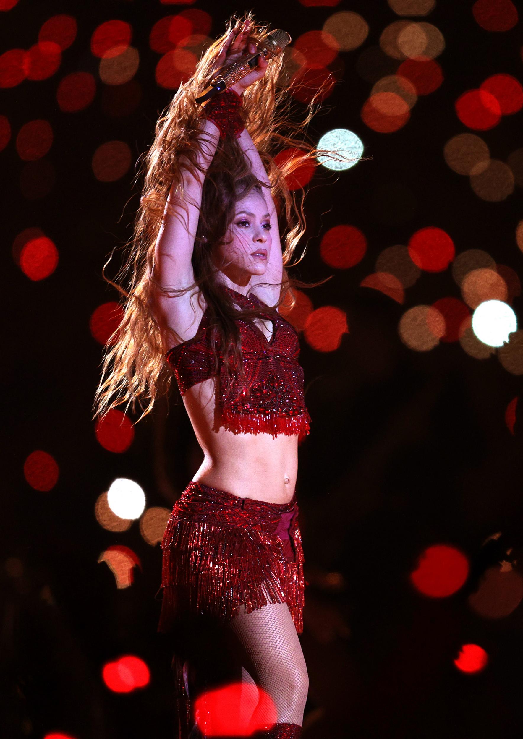 The singer transitioned into a crop top and skirt combo as she performed a solo belly dancing routine, before being joined by her dancers to sing her hit 2001 track 'Whenever, Wherever'.