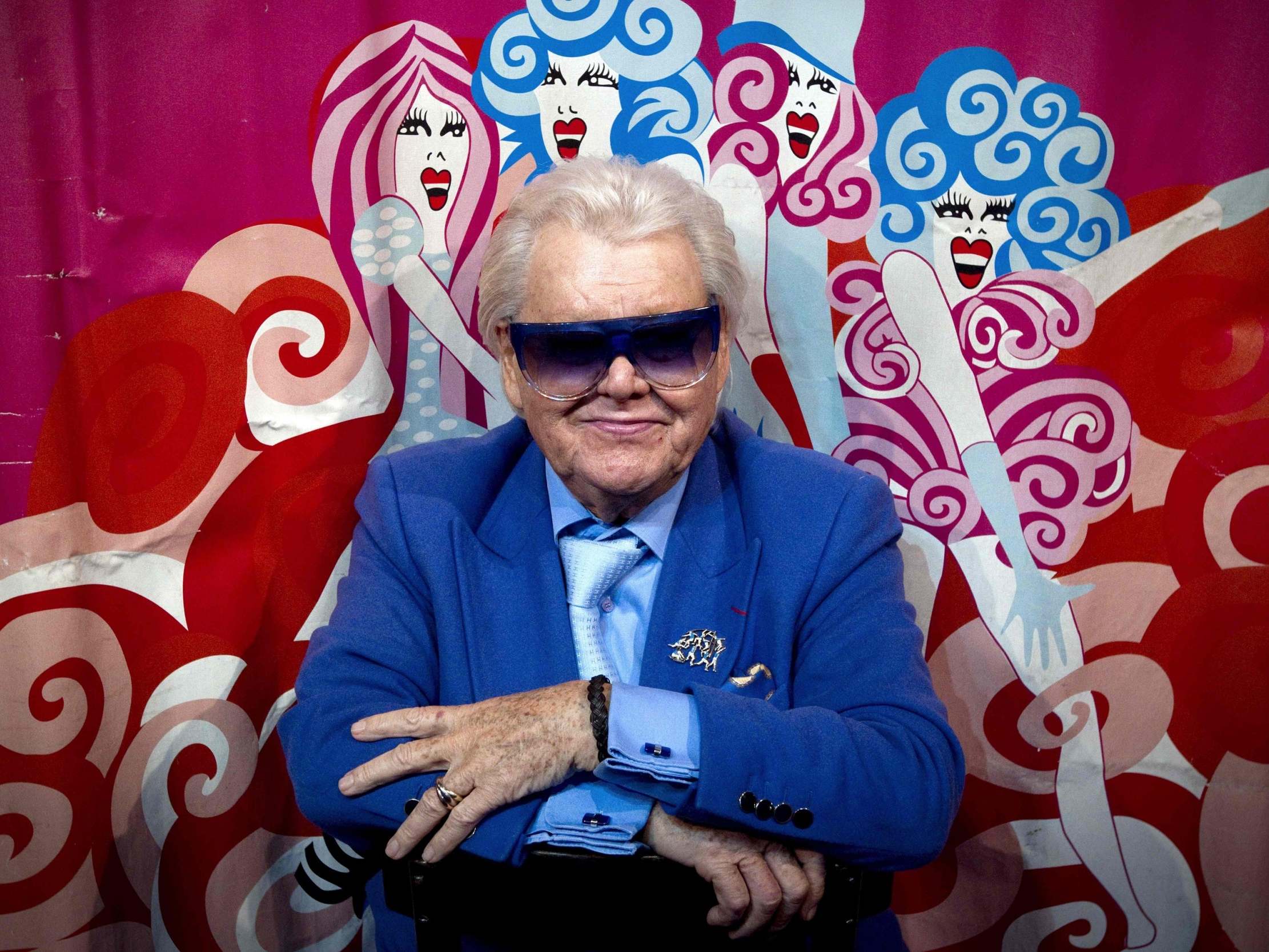 Always seated at a table near the bar, he greeted politicians and celebrities alike