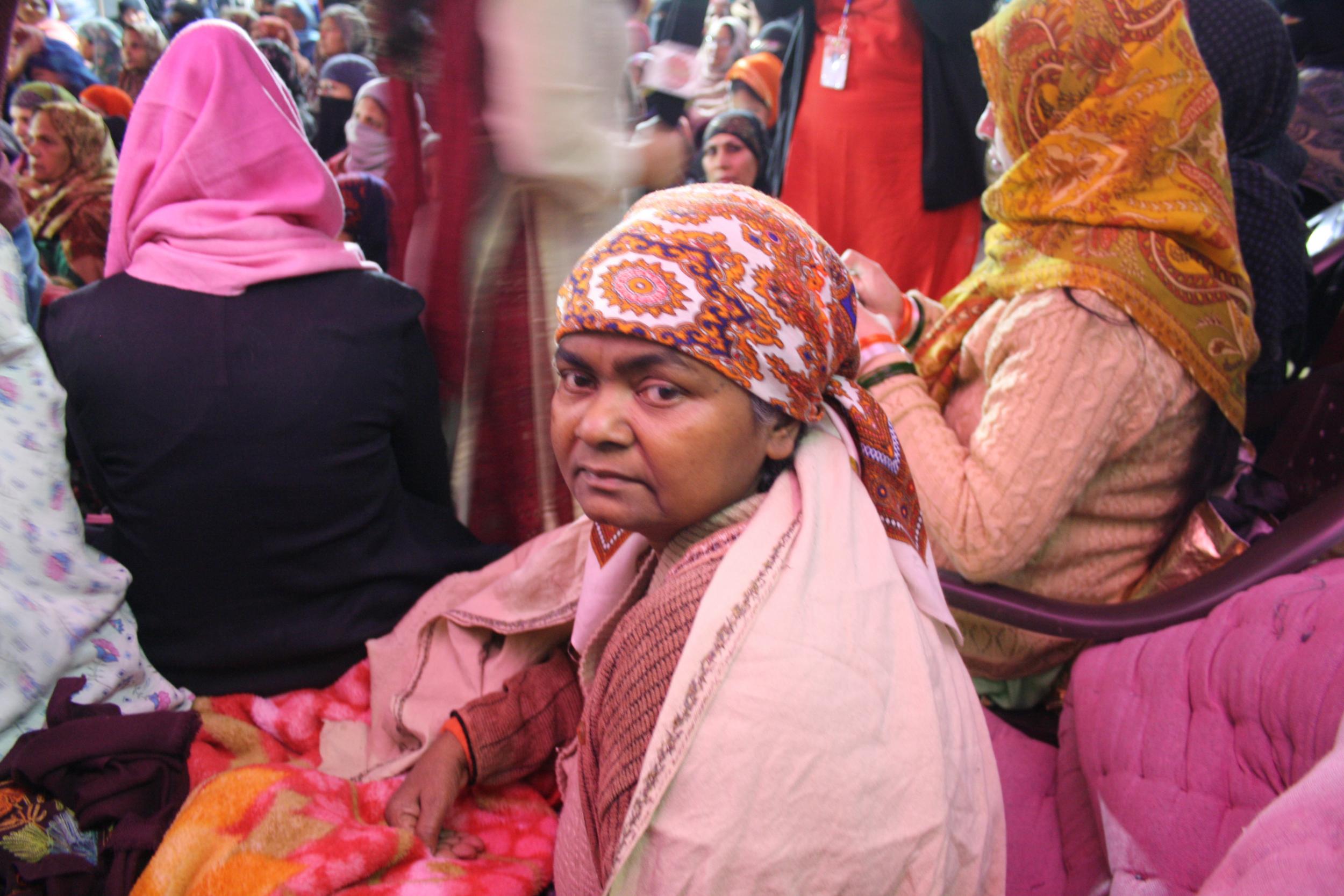 Mehrouni Shah, a woman in her fifties, is confined to a bed at the protest. She has been on hunger strike for 30 days