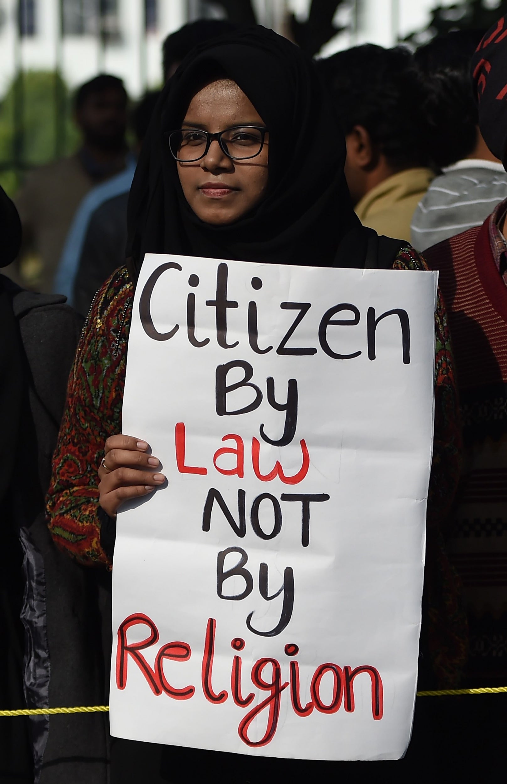 A woman holds up a placard during a demonstration at Jamia Millia Islamia university (AFP/Getty)