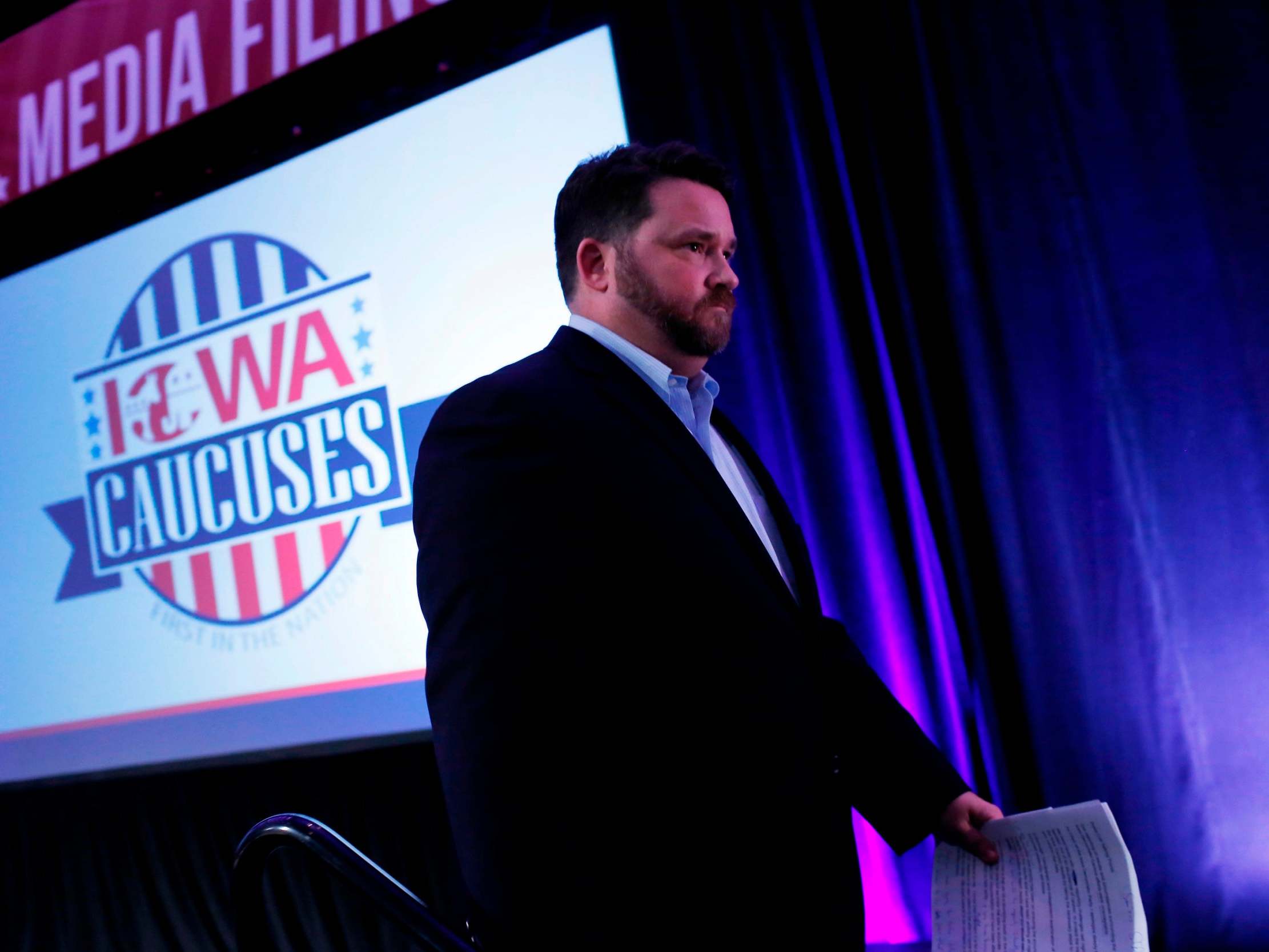 Chairman of the Iowa Democratic Party Troy Price exits the stage after speaking about the technical issues that delayed the Iowa Democratic caucuses results during a news conference at the Iowa Events Center on 4 February 2020