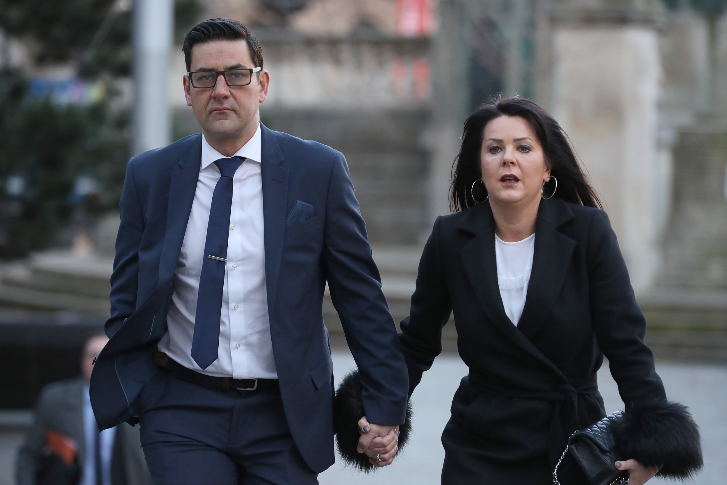 Andrew Woodward and partner Zelda Worthington arrive for the trial of Barry Bennell in 2018