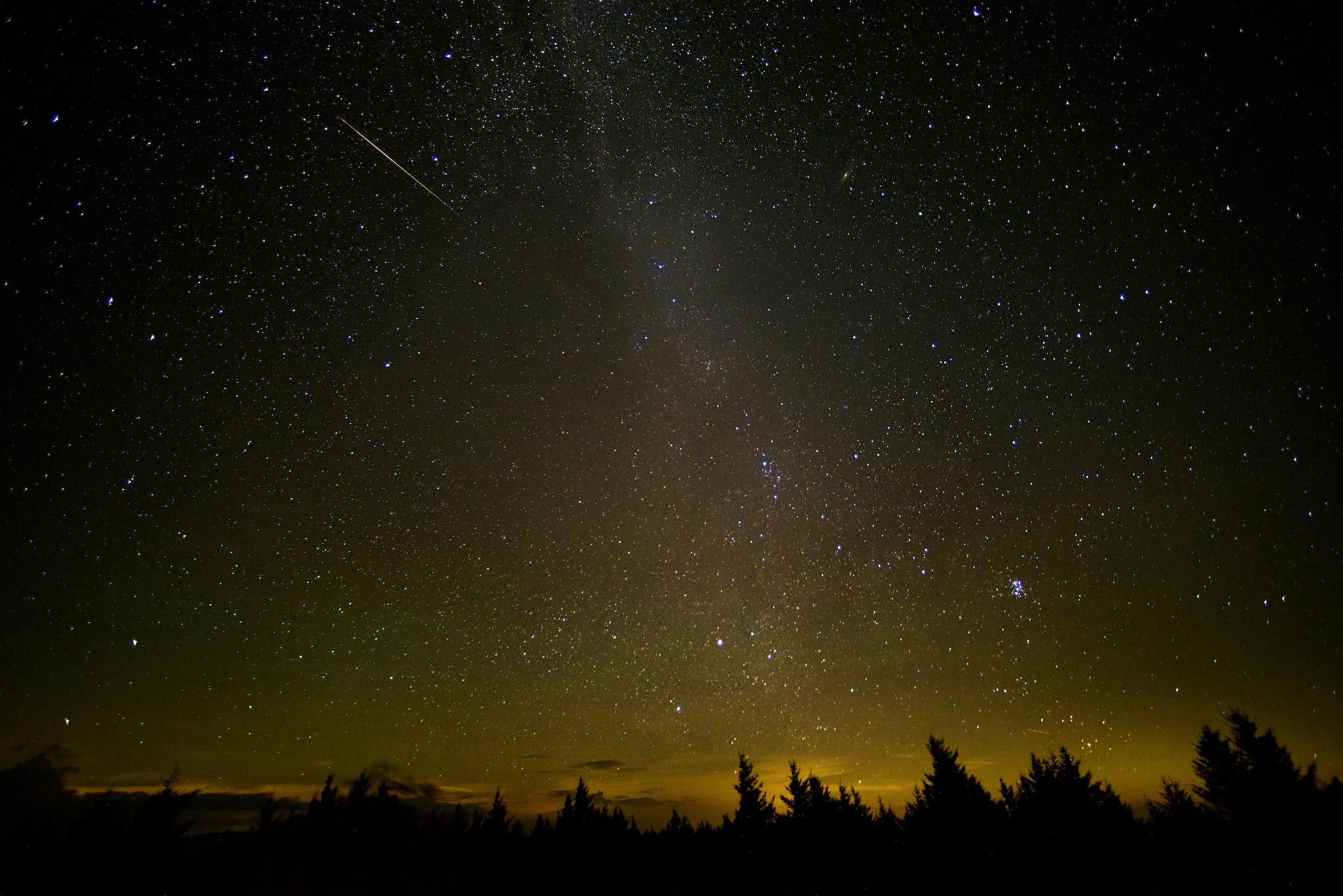 In this 30 second exposure, a meteor streaks across the sky during the annual Perseid meteor shower Friday, Aug. 12, 2016 in Spruce Knob, West Virginia