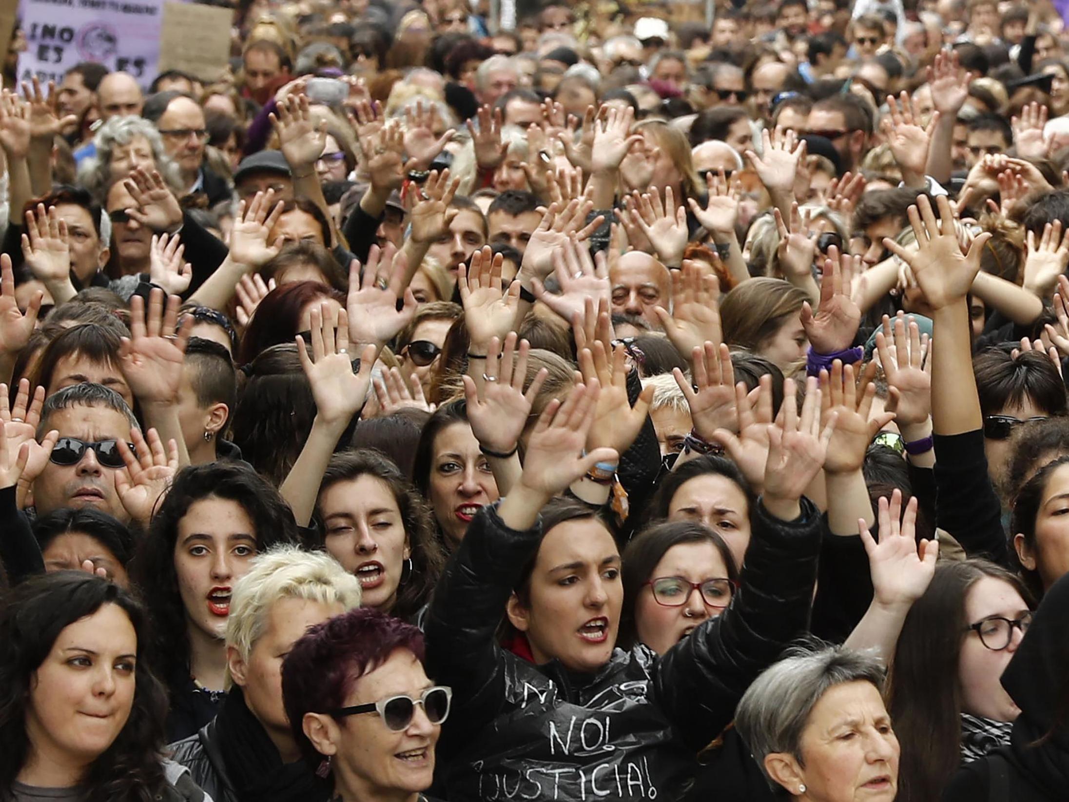 People shout slogans during a protest in Pamplona on April 28 2018 after the wolf pack gang had a sentence less severe than rape