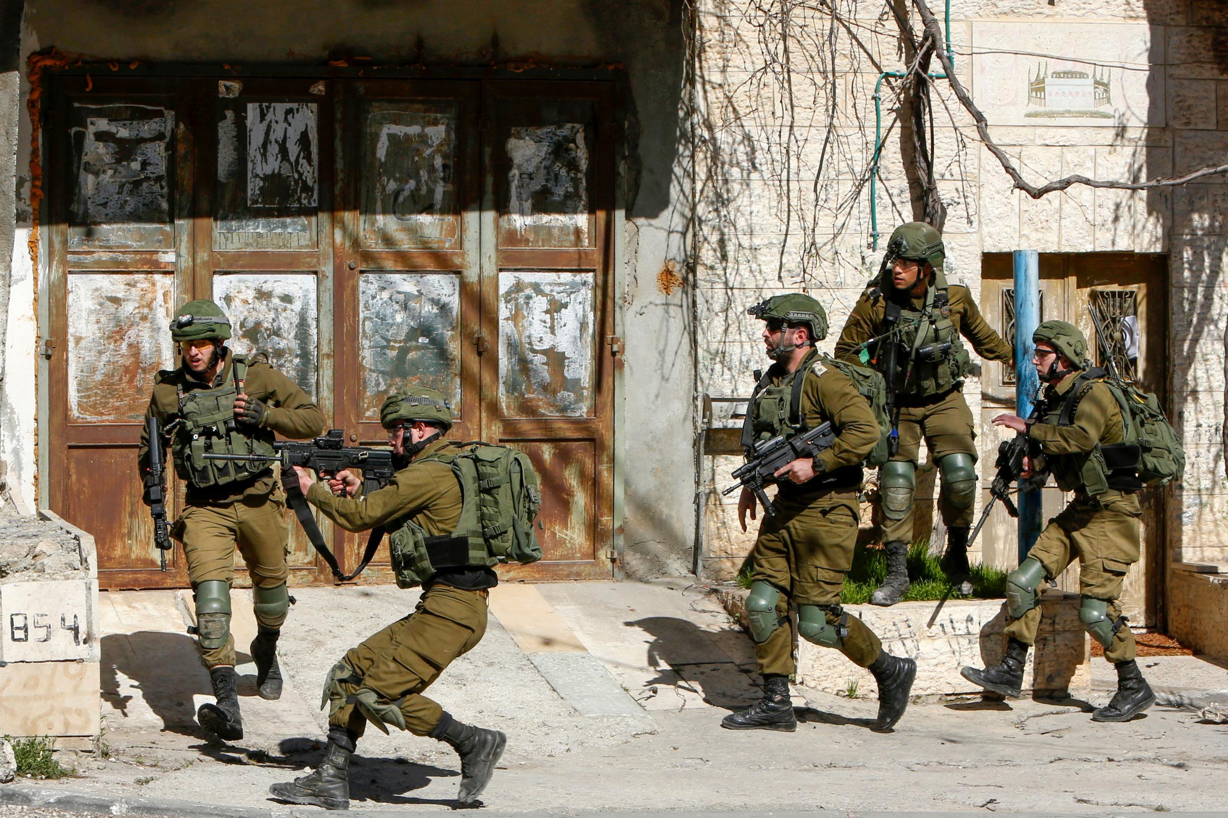 Israeli security forces during clashes with Palestinians following a raid in the Bethlehem area this morning in search of a suspect wanted for a car-ramming attack earlier in Jerusalem that left several people injured