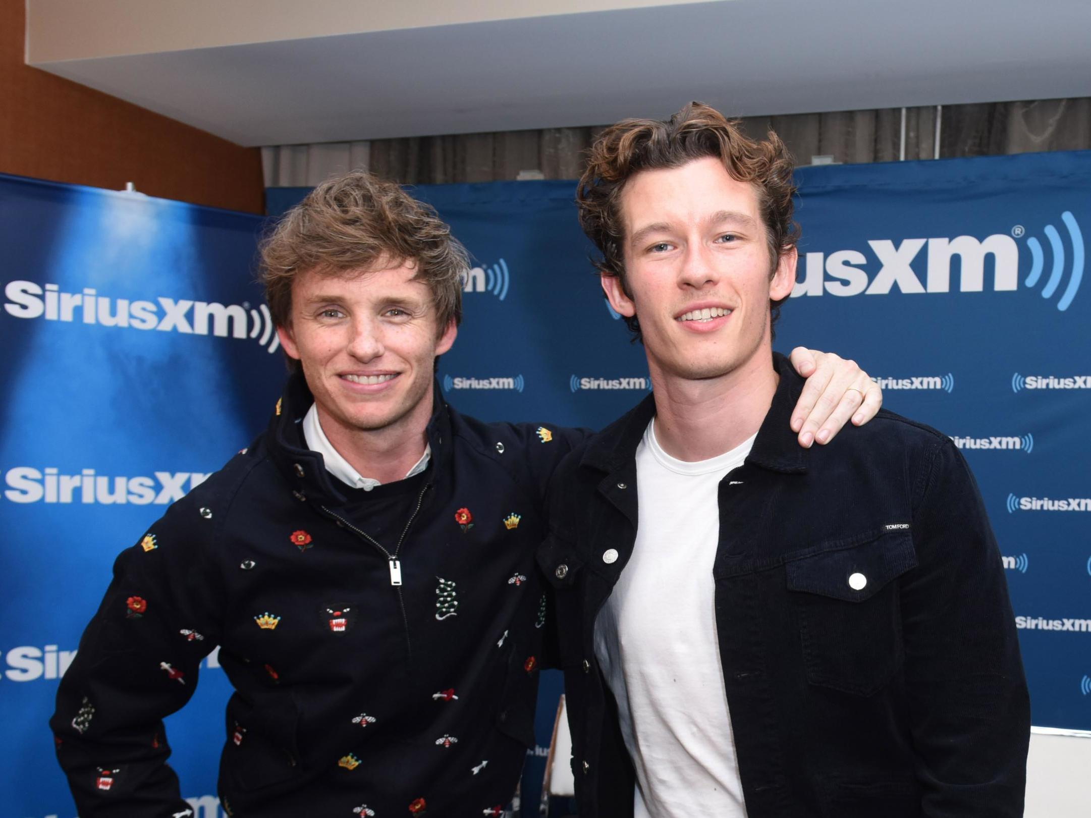 Callum Turner and Eddie Redmayne promoting Fantastic Beasts in 2018