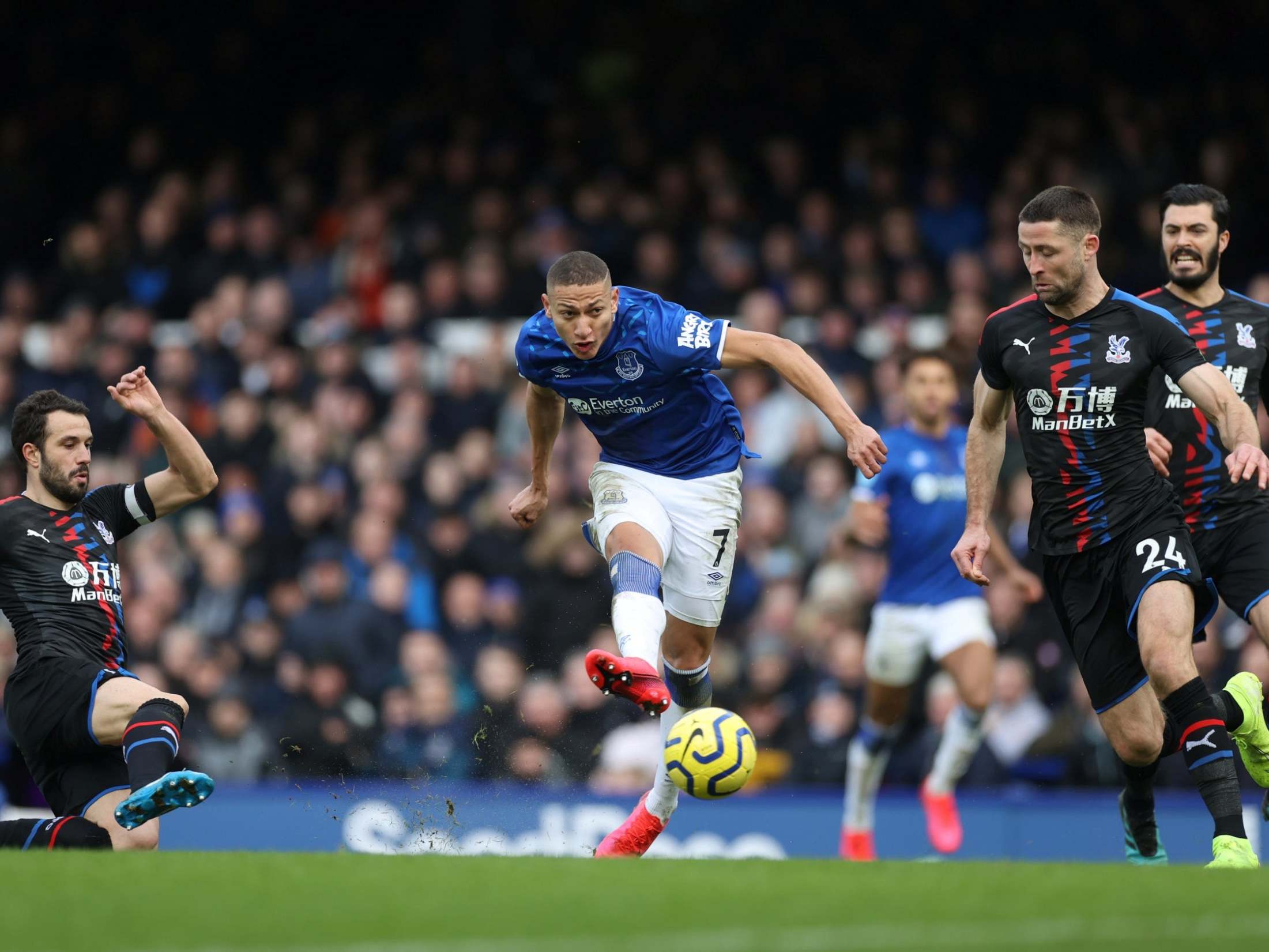 Richarlison curls the ball into the bottom corner