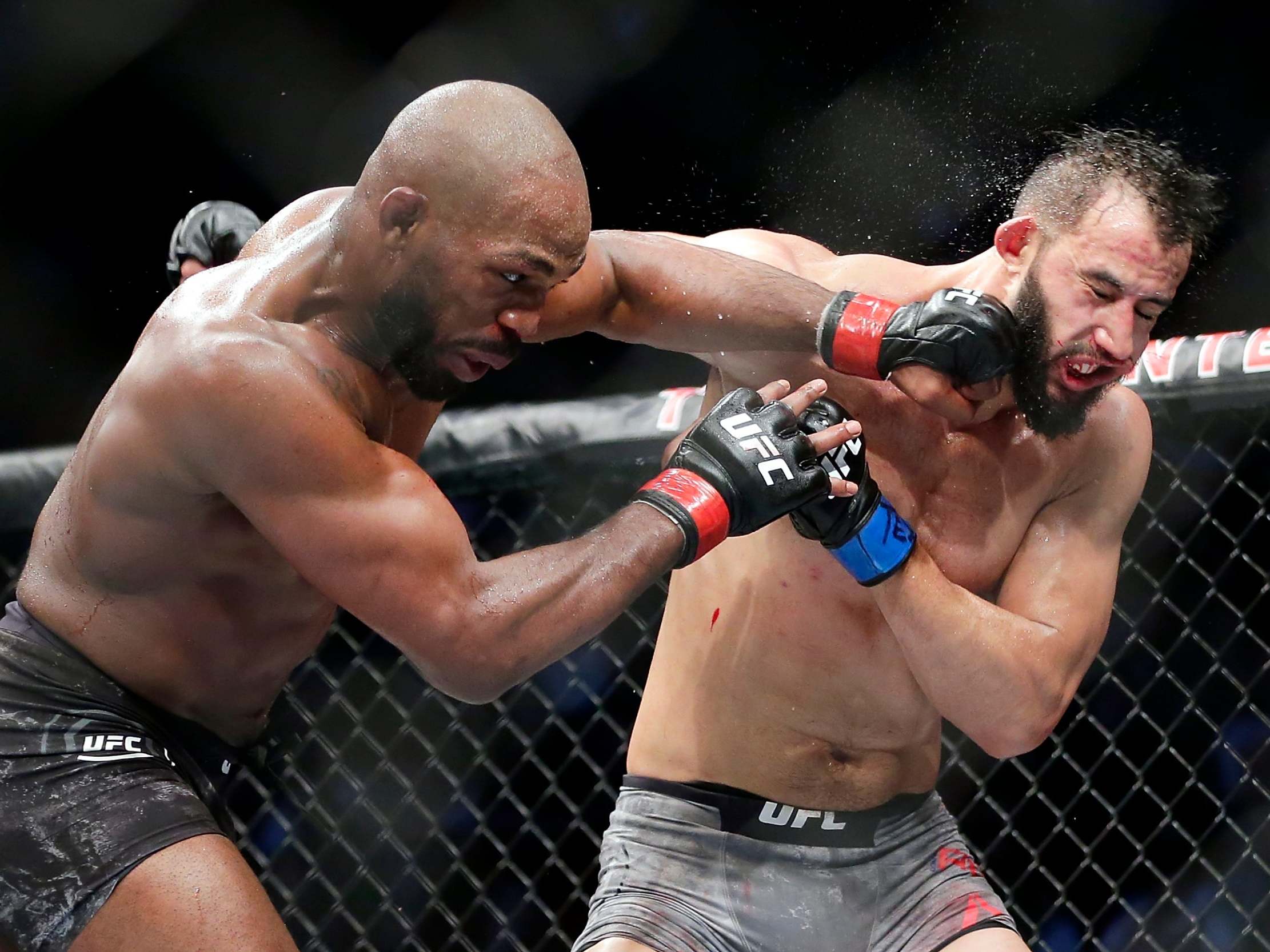 Jones (left) in his last bout, against Dominick Reyes in February