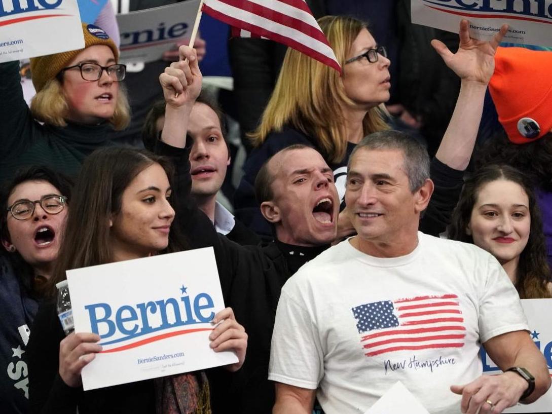 Sanders supporters react during a Primary Night event at the SNHU Field House in Manchester New Hampshire on 11 February 2020