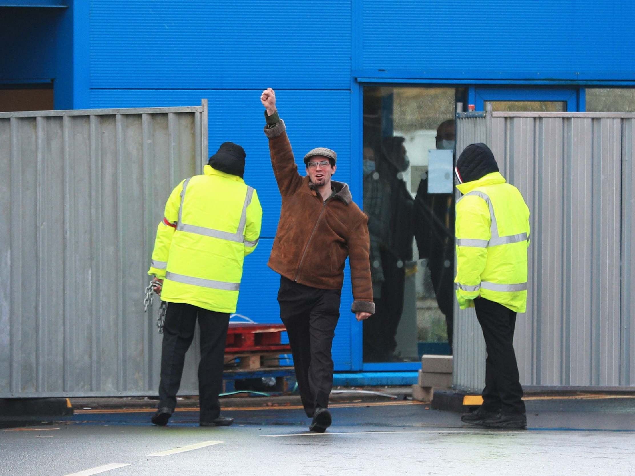 Matt Raw punches the air as he leaves Arrowe Park Hospital on the Wirral