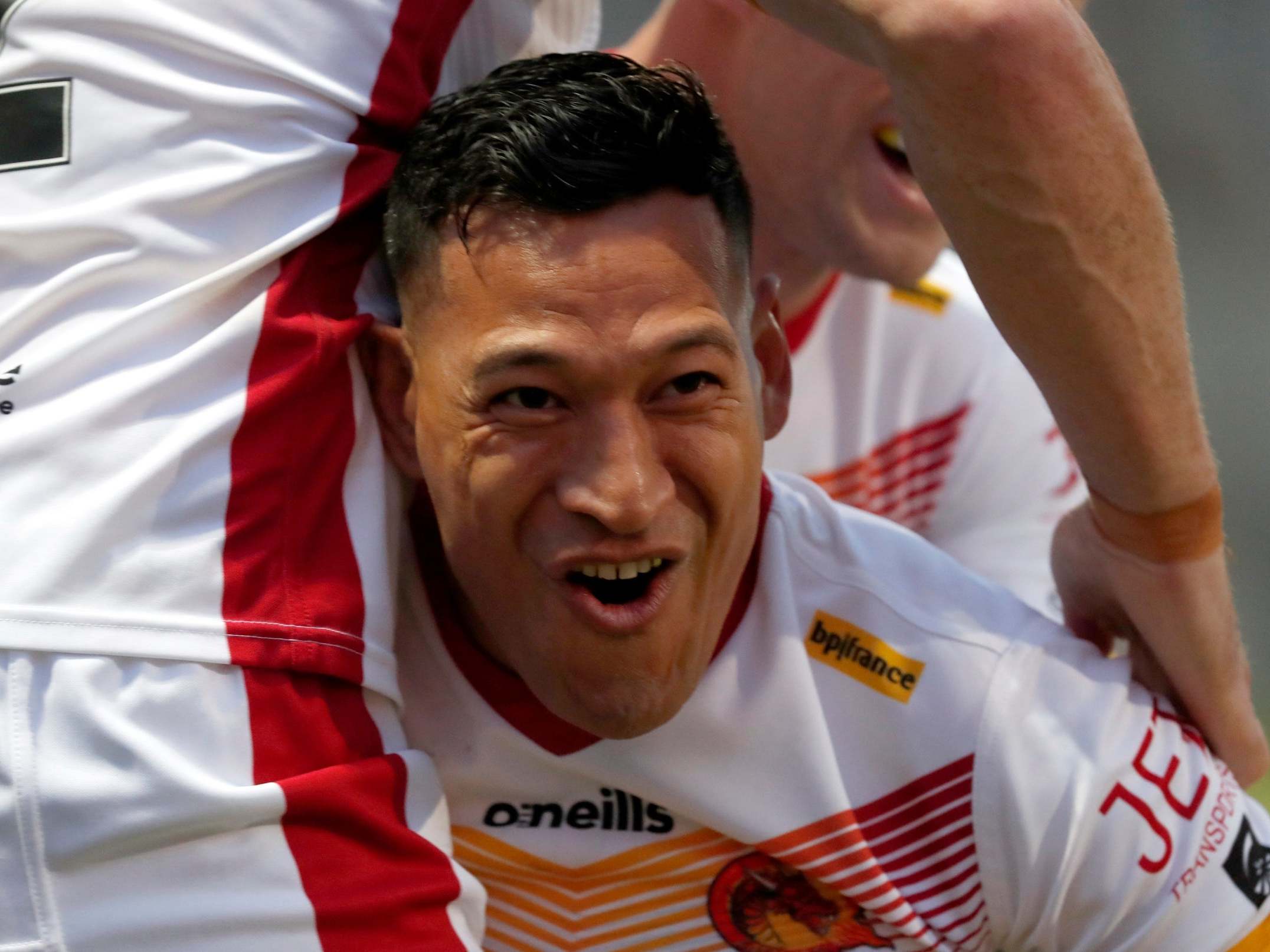 Israel Folau celebrates scoring a try