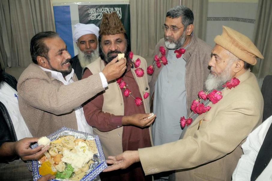 Supporters of Jamaat-e-Islami celebrate after Pakistani academic Junaid Hafeez was sentenced to death for posting blasphemous content on Facebook